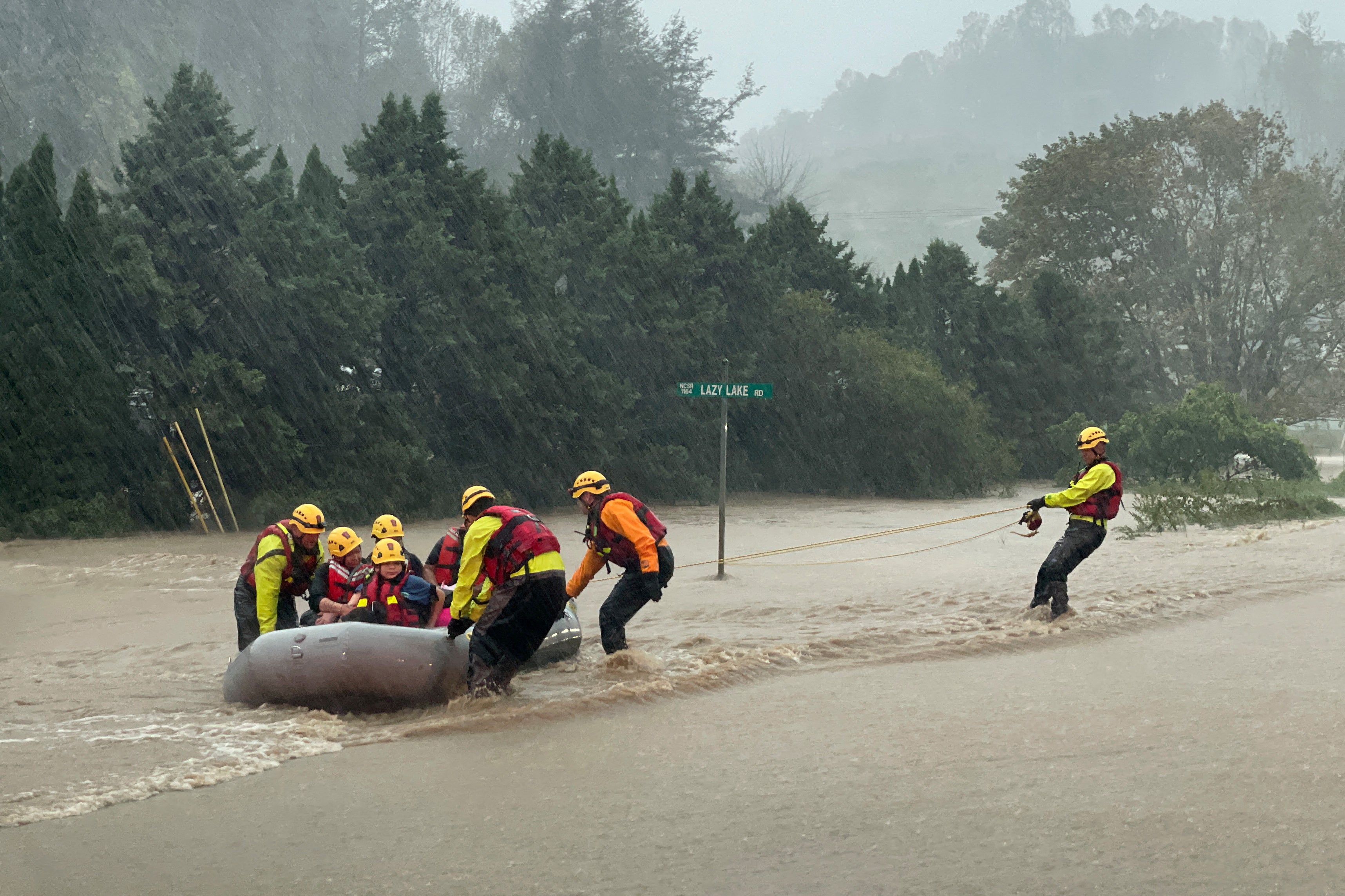 A swift water team rescues residents from severe flooding on Friday in Boone, North Carolina