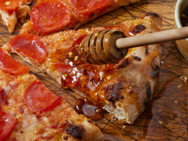 <p>Hot honey started life as a condiment to drizzle over pizza</p>