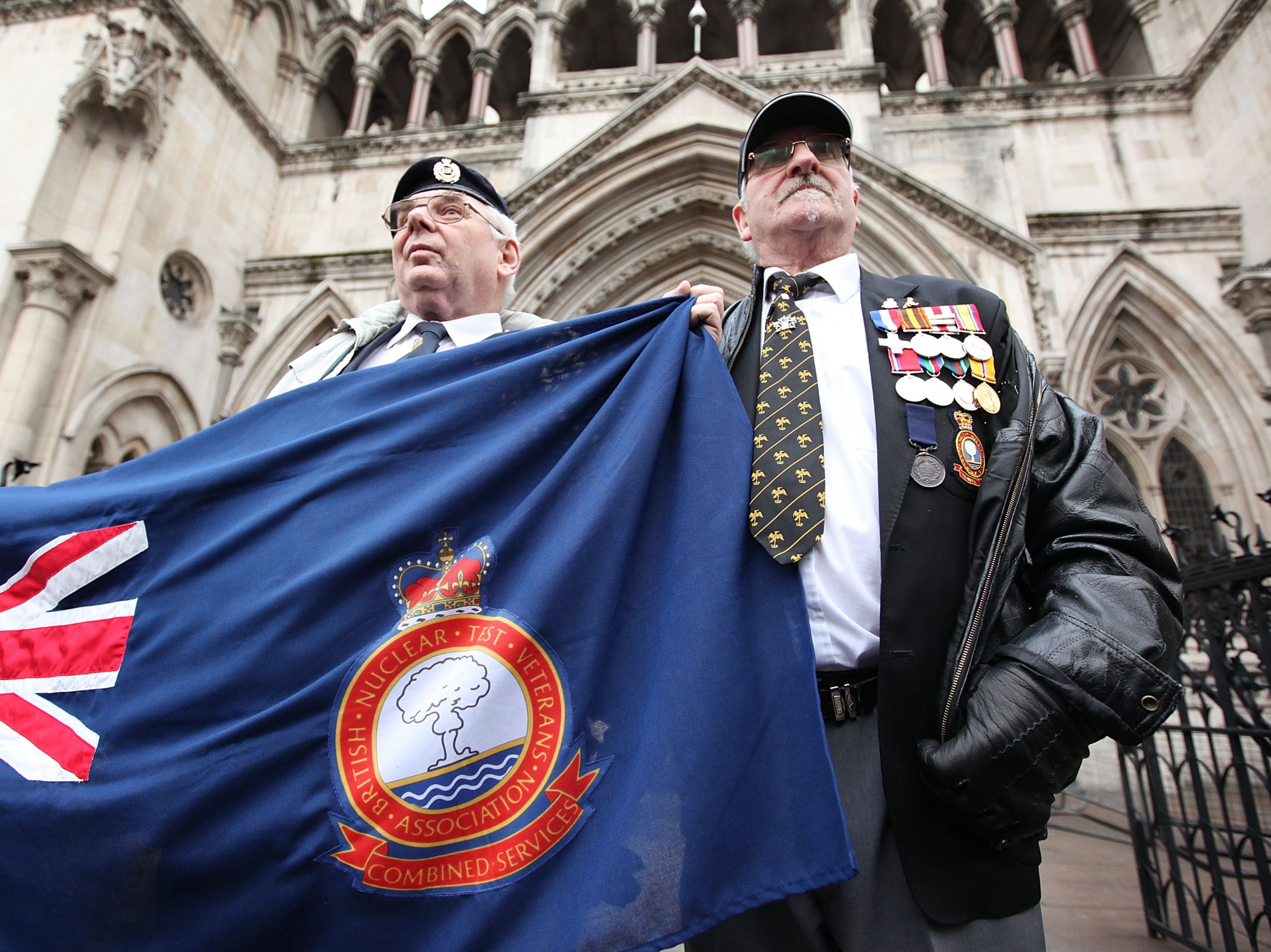 Nuclear test veterans stand outside the High Court in London in 2009