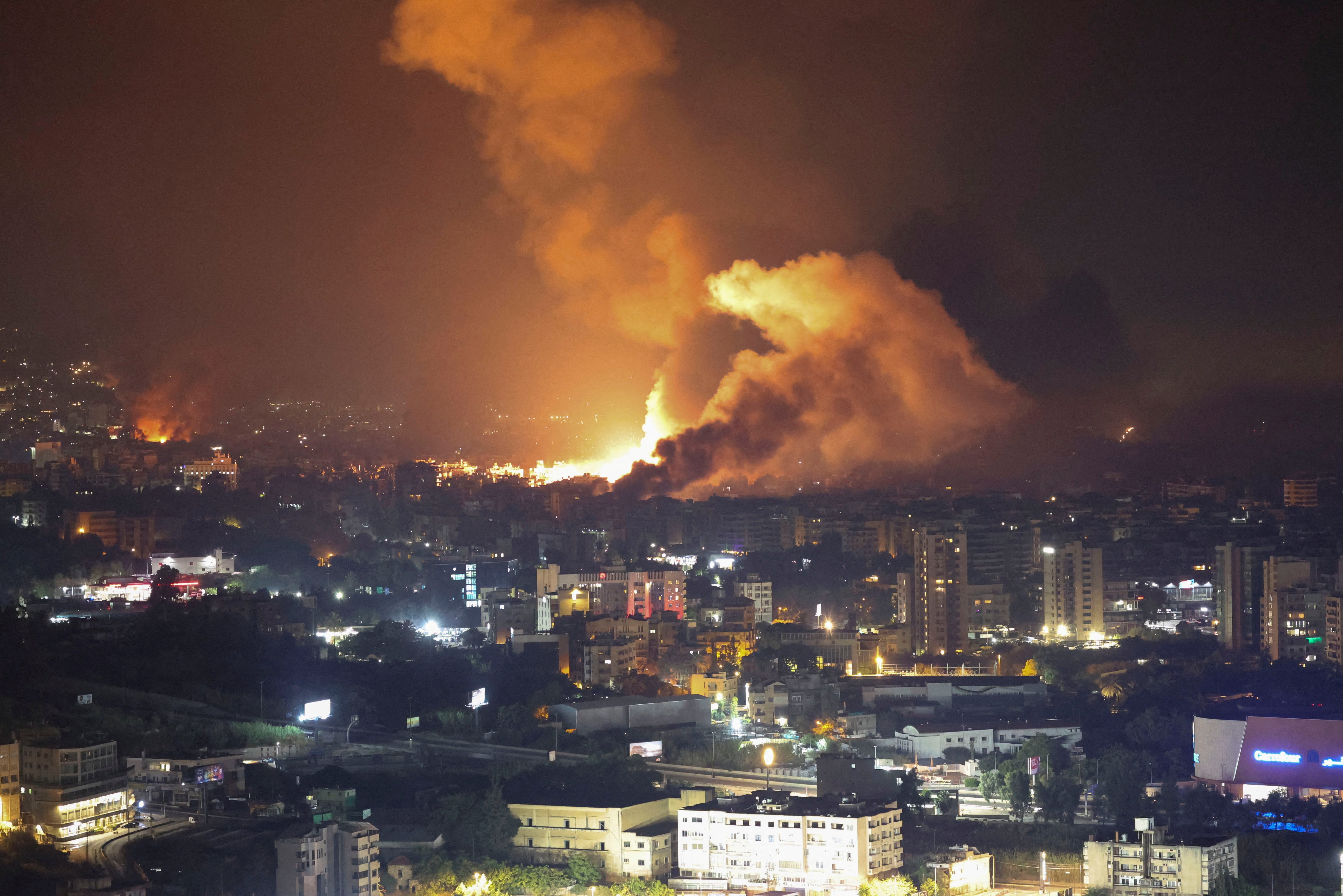 Smoke billows over Beirut’s southern suburbs, as seen from Sin El Fil