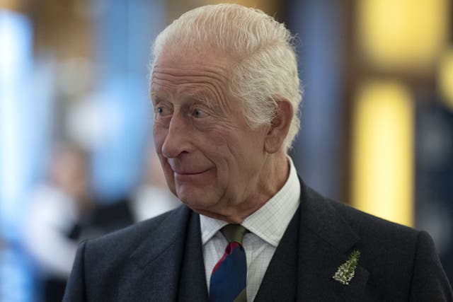 King Charles was given a hug by one woman who asked about his health as he met ‘local heroes’ at Holyrood (Jane Barlow/PA)