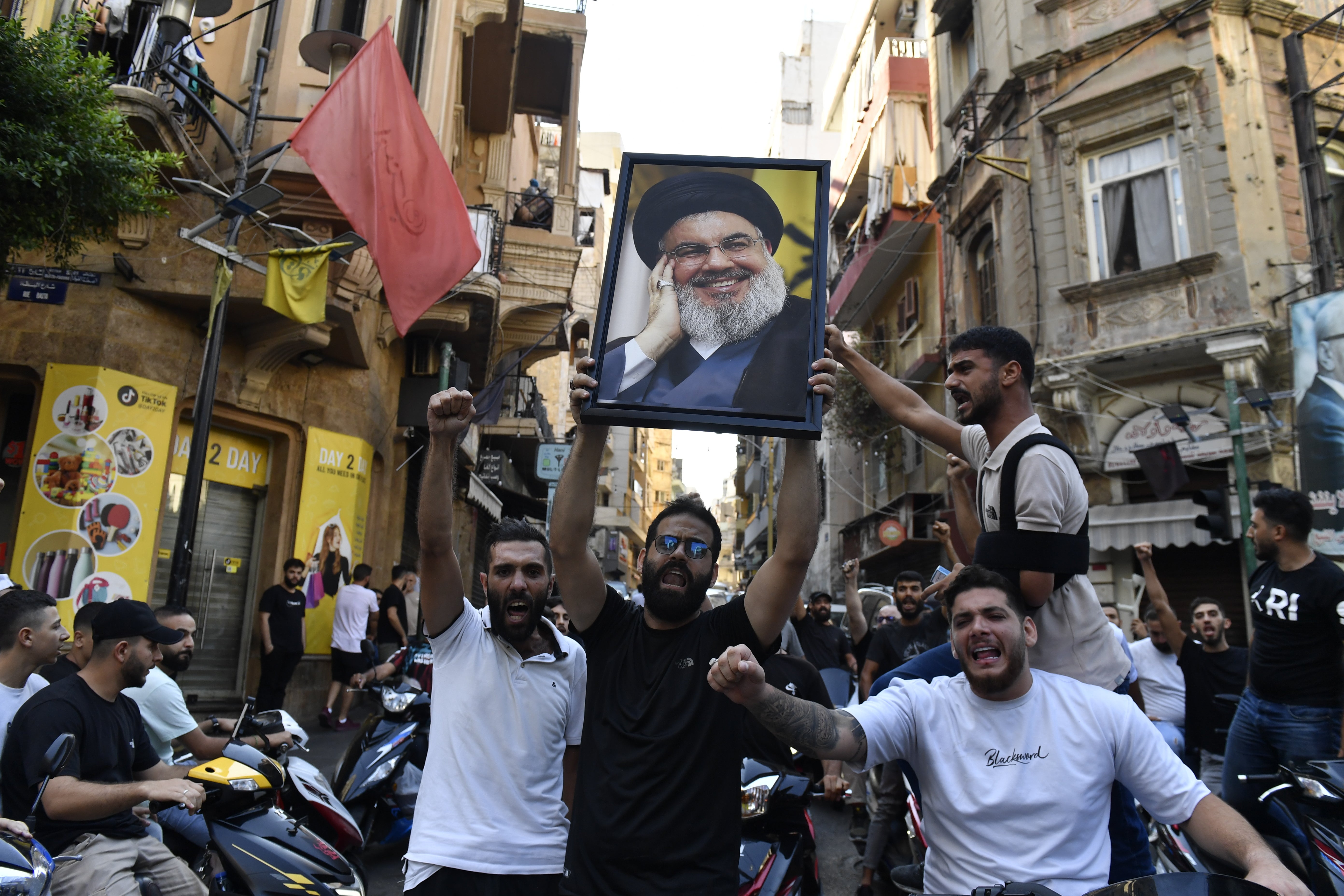 A group gather carrying Nasrallah's poster in Beirut, Lebanon