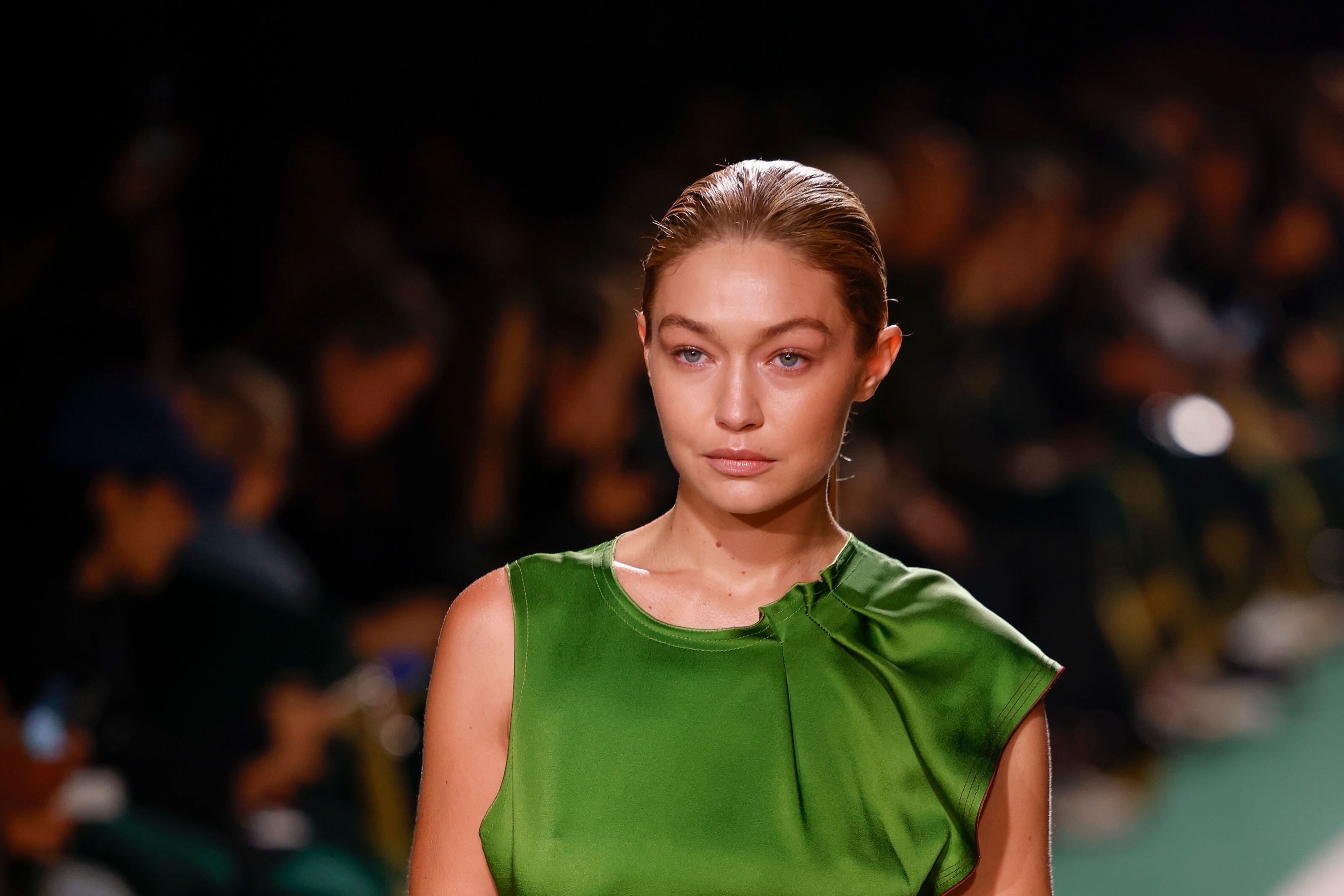 Gigi Hadid wore an emerald green gown to walk the runway (Vianney Le Caer/AP)