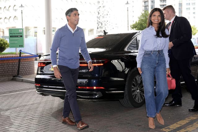 Conservative party leader Rishi Sunak with his wife Akshata Murty arriving in Birmingham (PA)