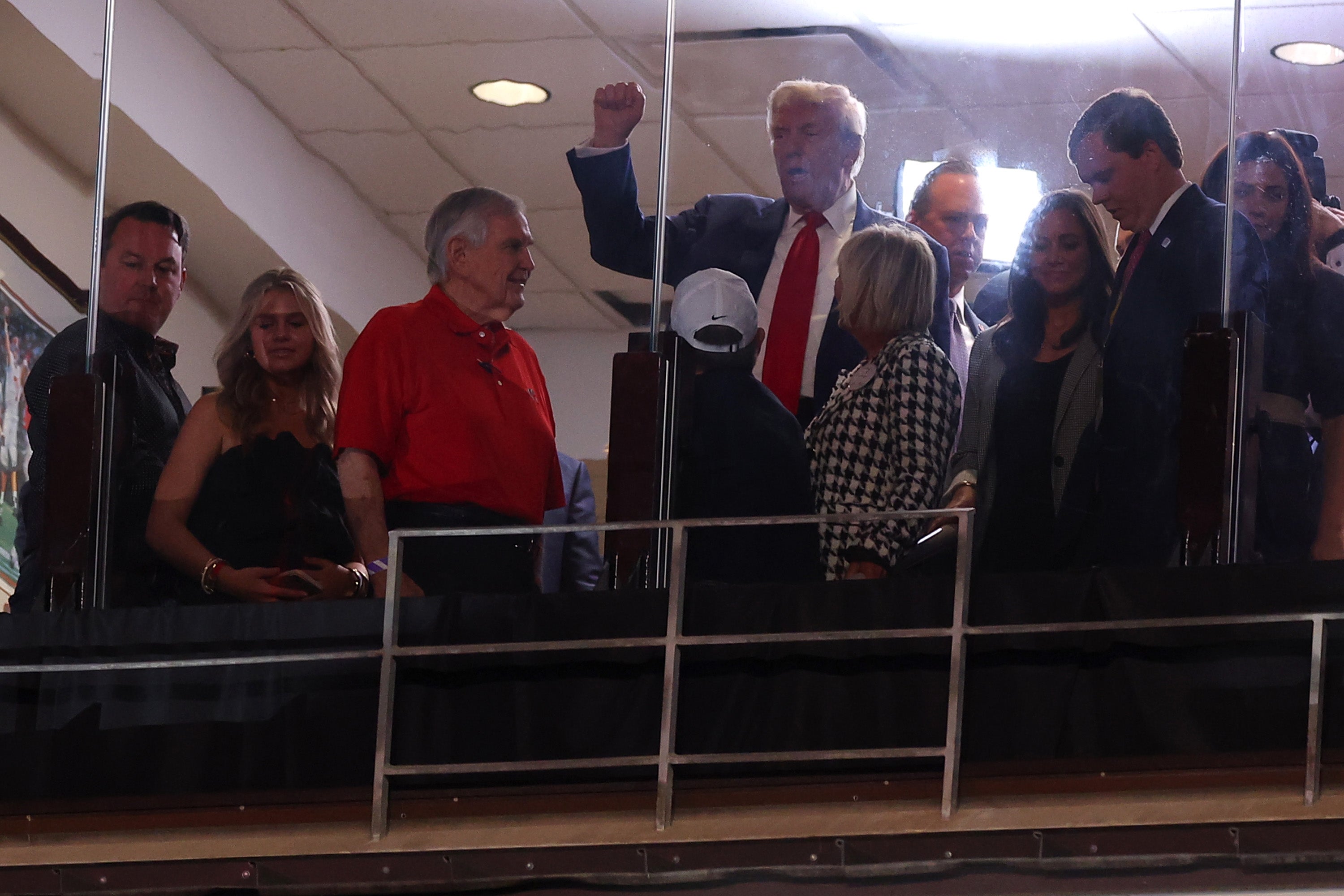 Former President Donald Trump looks on during the first quarter of the game between the Alabama Crimson Tide and the Georgia Bulldogs at Bryant-Denny Stadium