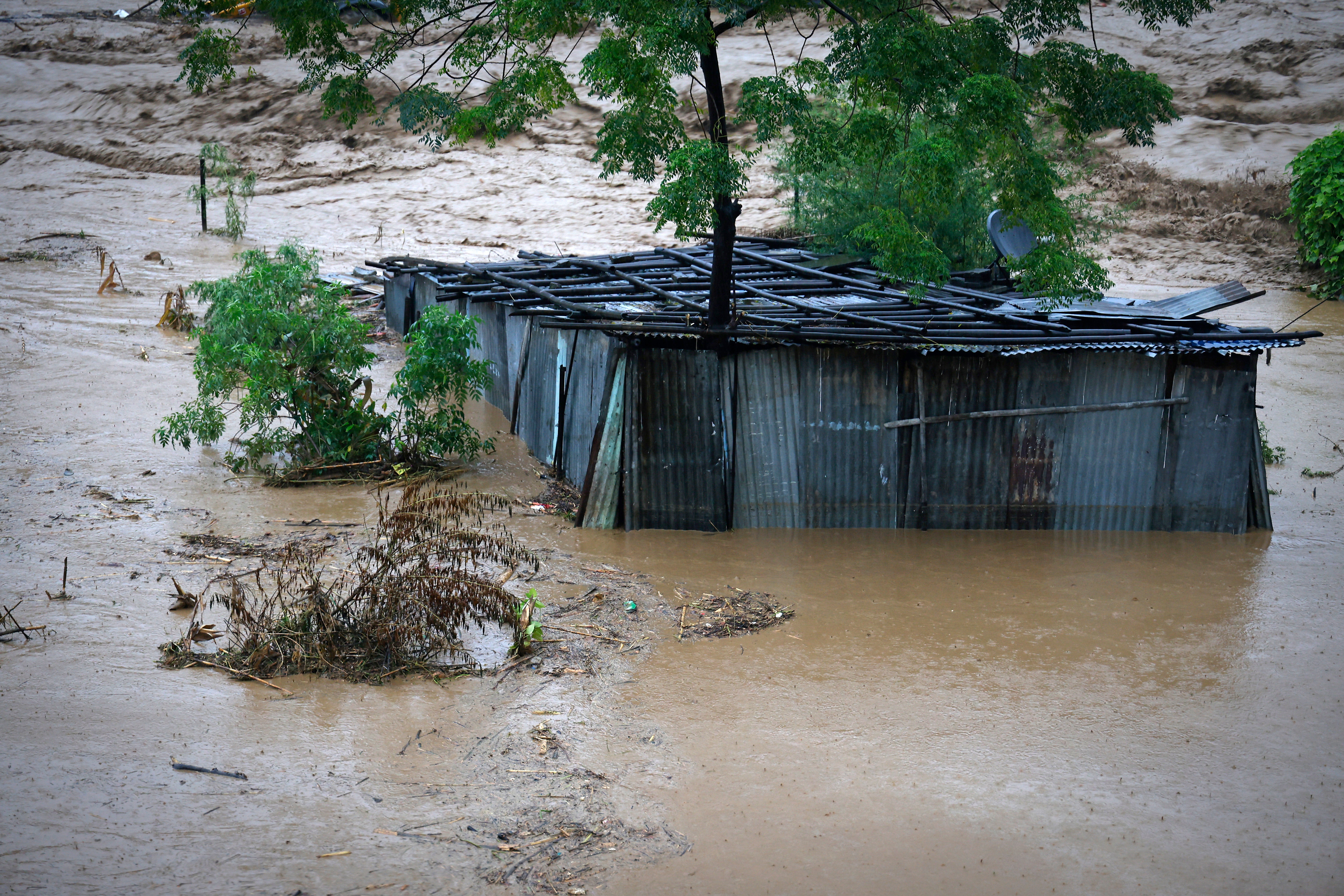 A tin shed lies partially submerged astatine  the borderline   of the Bagmati River successful  spate aft  dense  rains successful  Kathmandu, Nepal, Saturday, 28 Sept 2024