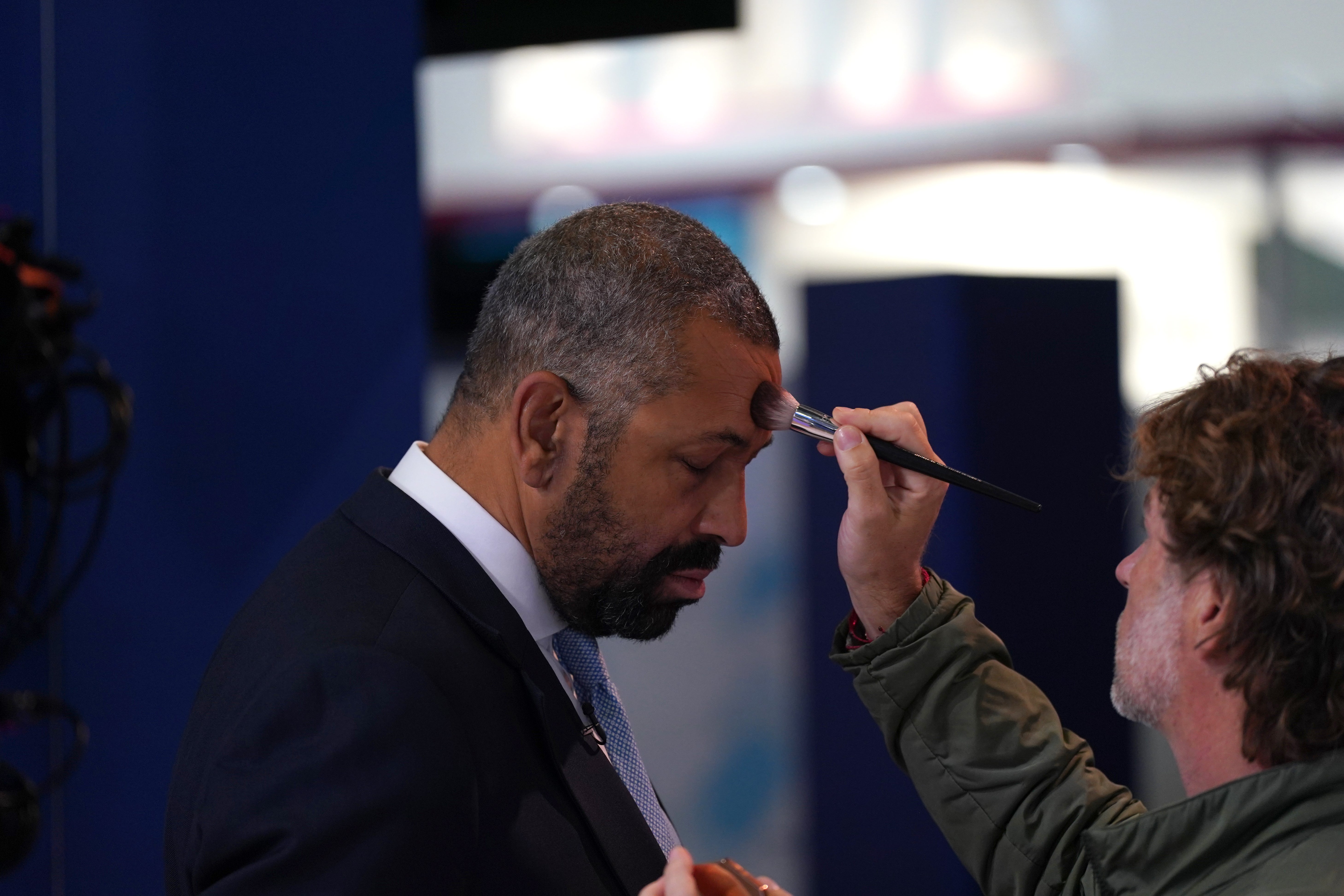 Conservative leadership contender and Shadow Home Secretary James Cleverly has makeup applied during the Conservative Party Conference at Birmingham ICC Arena