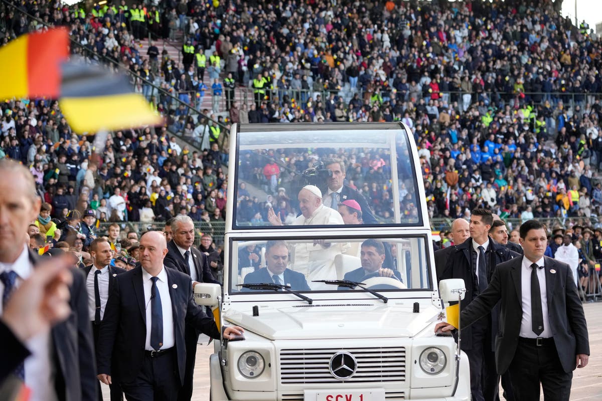 Pope wraps troubled visit to Belgium by beatifying 17th century mystic during sunny stadium Mass