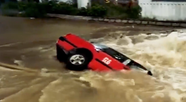 <p>Hong Kong taxi plunges into sinkhole</p>