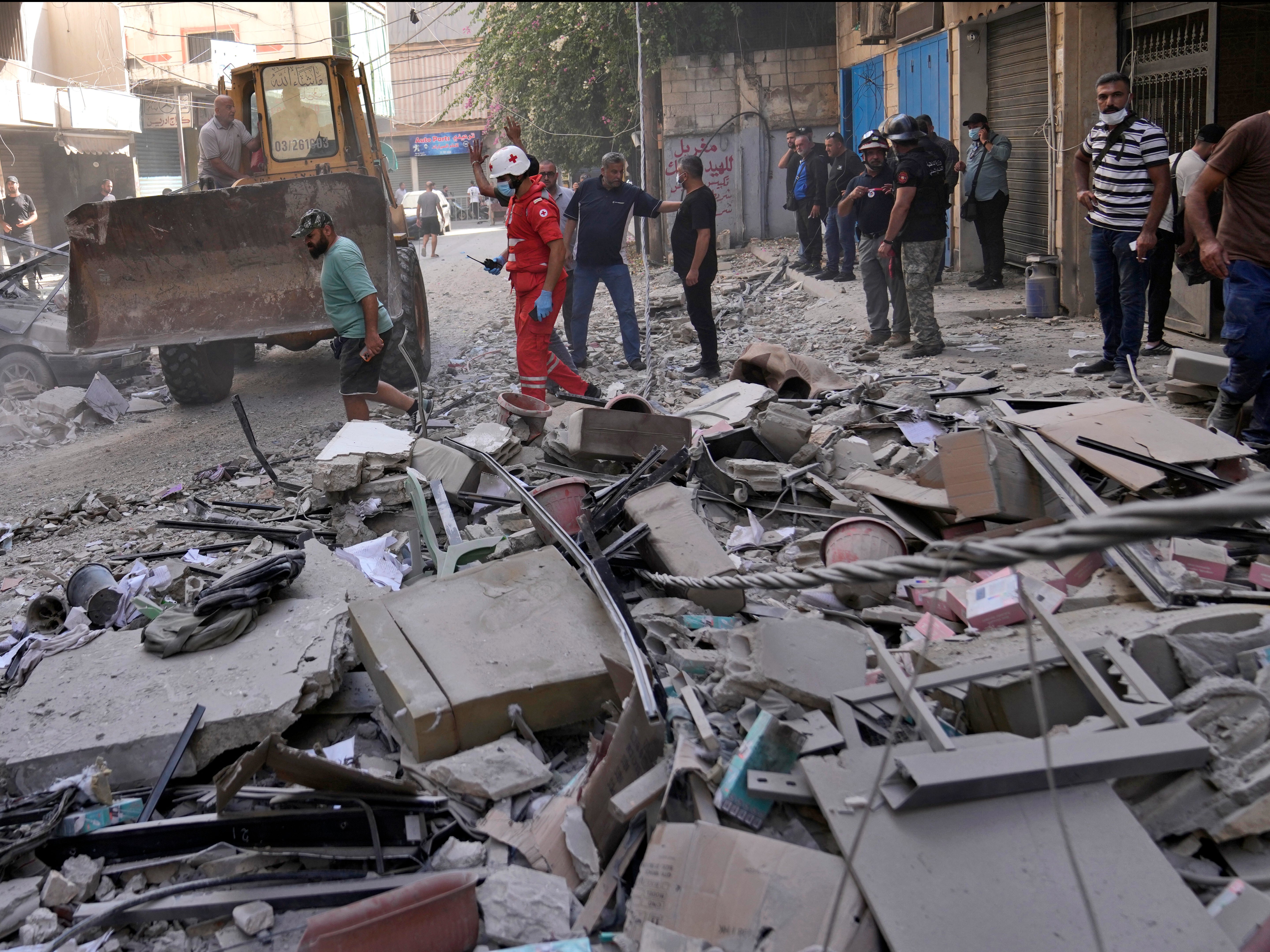 Rescuers at the scene of an Israeli airstrike in Beirut’s suburb of Ghobeiri