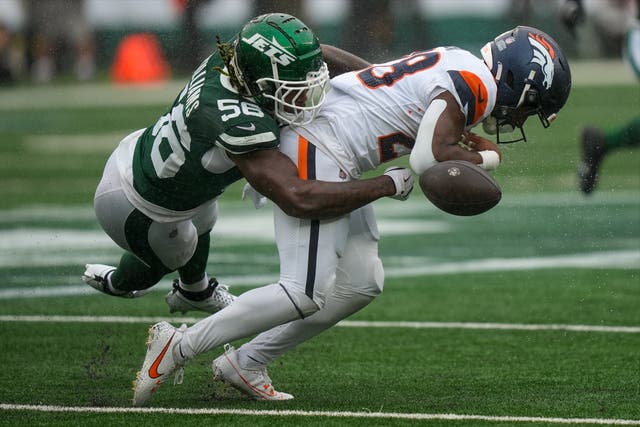 <p>Badie (right) had caught a pass on a third down play shortly before the end of the opening quarter and was immediately hit by the Jets’ Quincy Williams (left) </p>