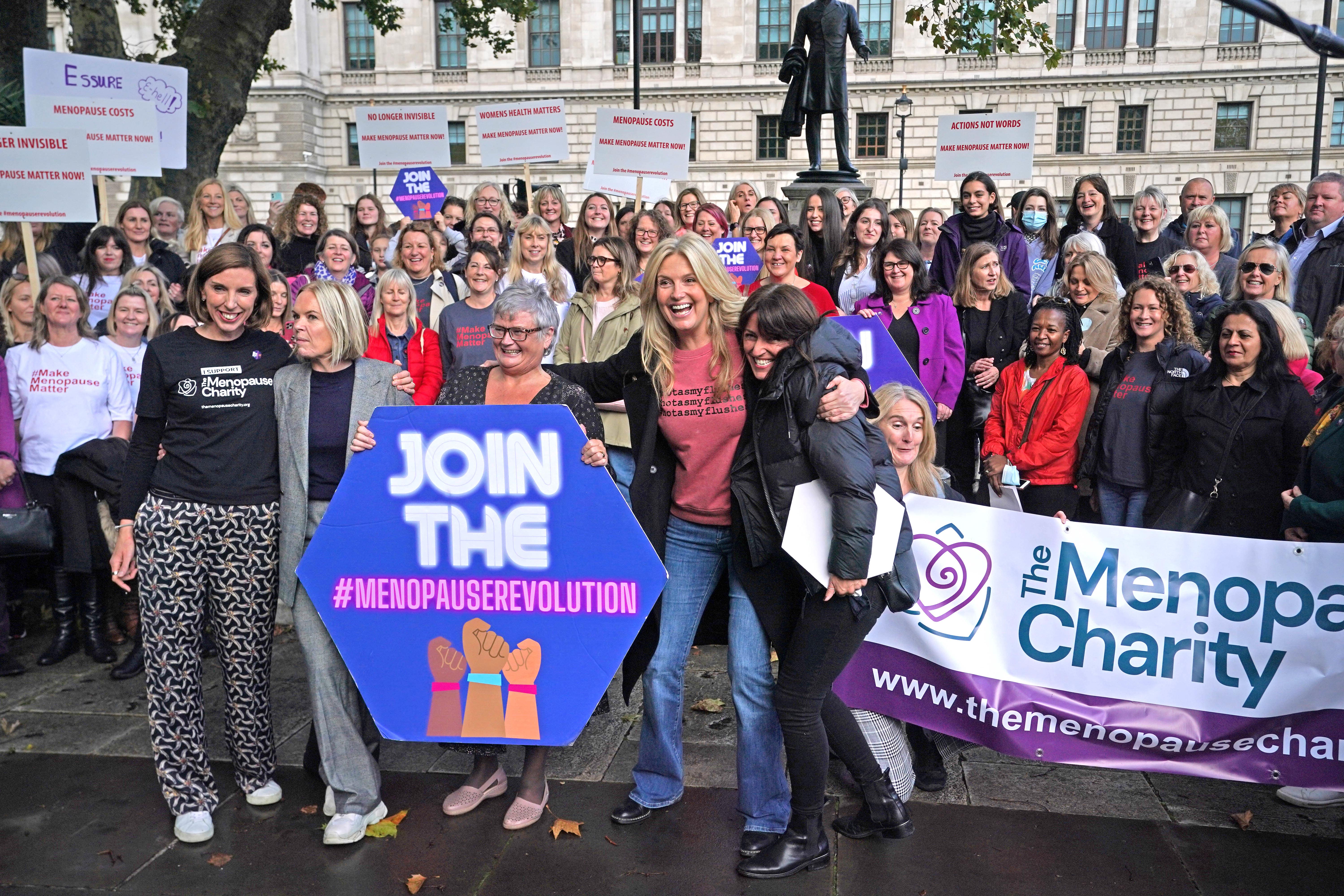 (Left to right) Dr Louise Newson, Mariella Frostrup, MP Carolyn Harris, Penny Lancaster and Davina McCall with protesters outside the Houses of Parliament in London demonstrating against ongoing prescription charges for HRT (Steve Parsons/PA)