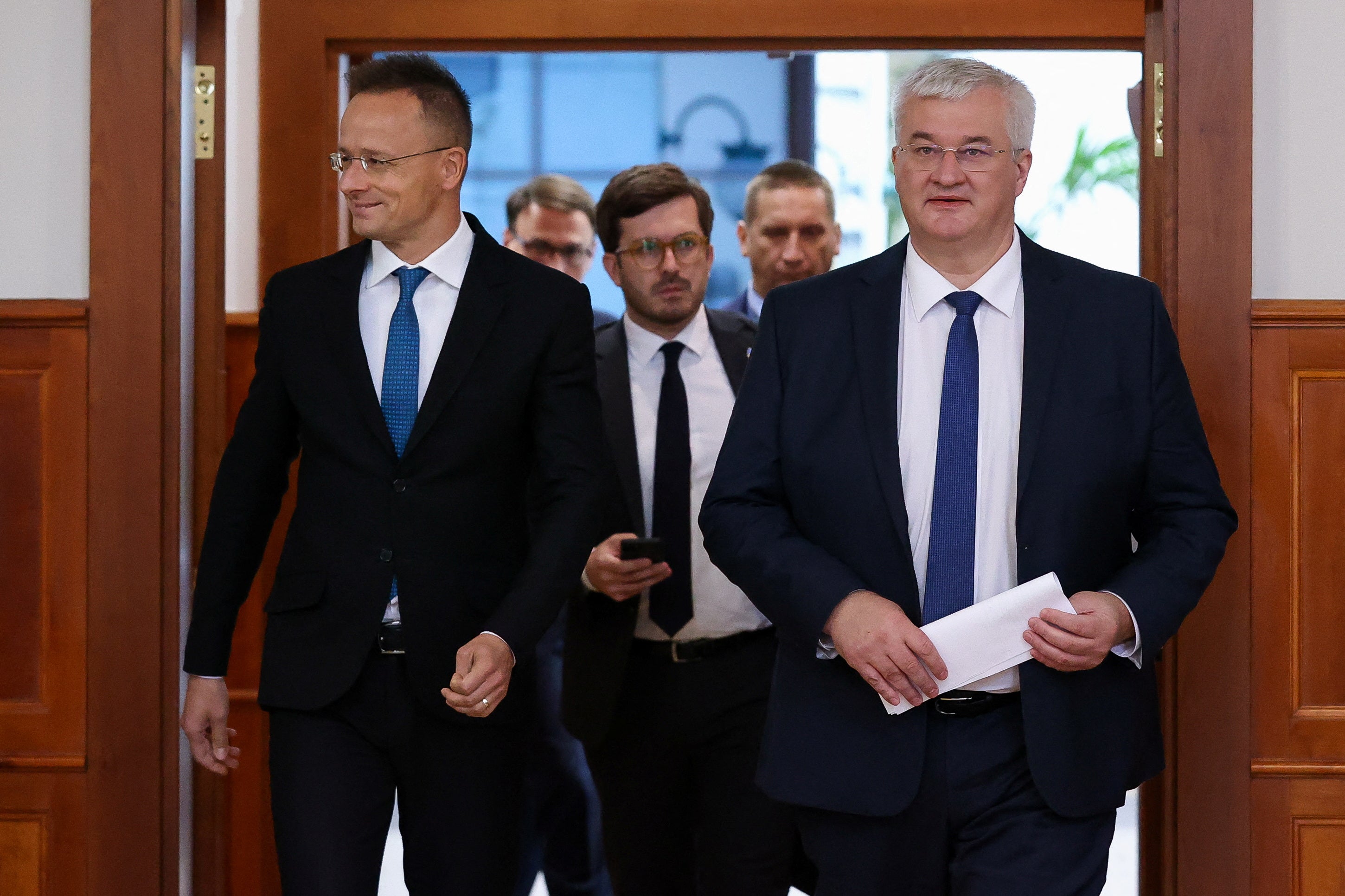 Ukraine’s new Foreign Minister Andrii Sybiha walks with his Hungarian counterpart during a visit to the neighbouring country