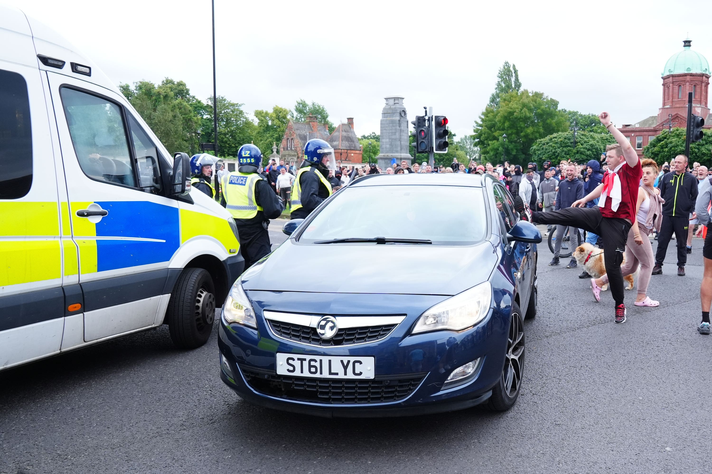 Jake Wray, 23, kicks a car during disorder in Middlesbrough on August 4 (Owen Humphreys/PA)