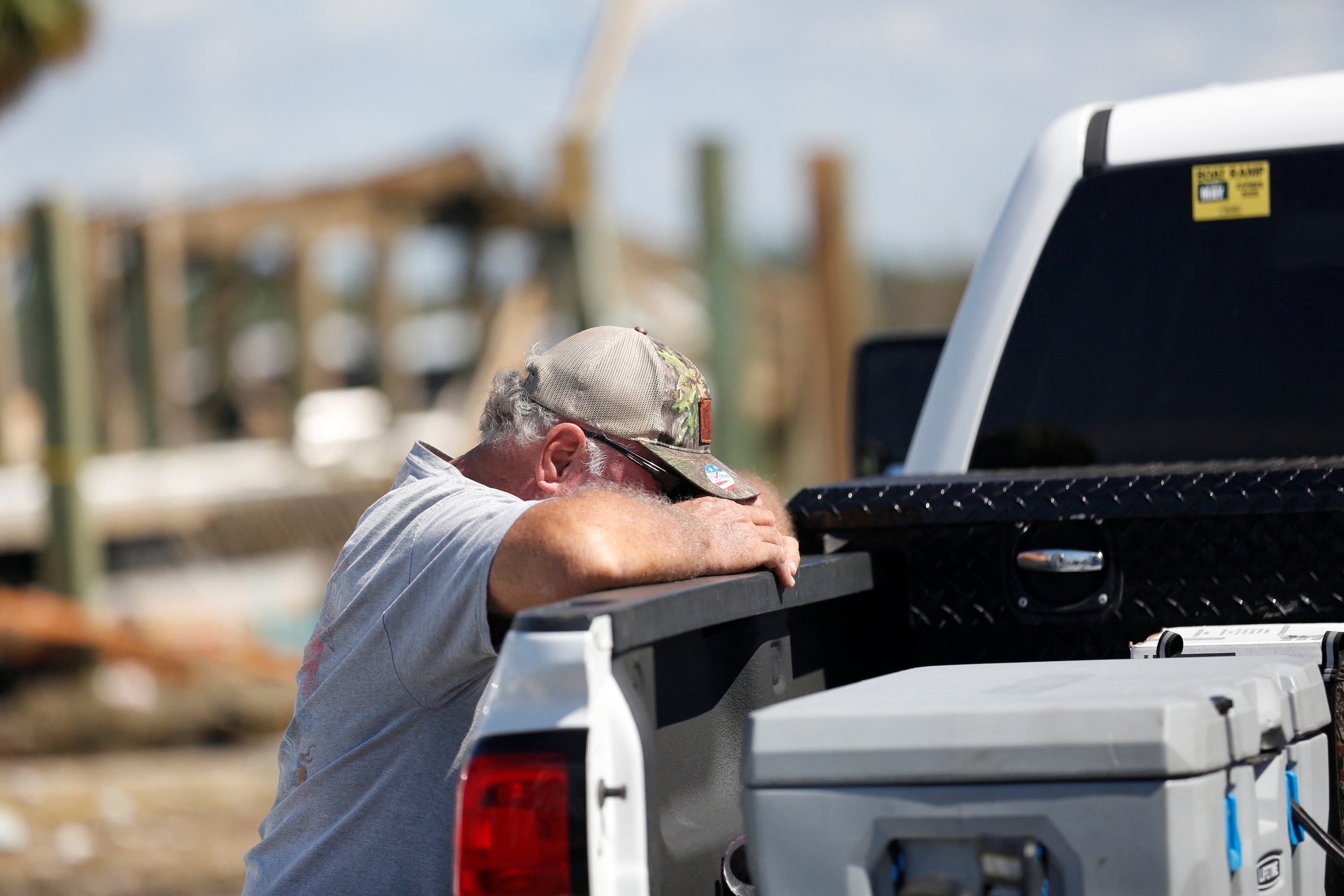 Greg Staab, a resident of Keaton Beach, gets emotional while recovering belongings from his property after Hurricane Helene passed through the Florida panhandle, severely impacting the community in Keaton Beach, Florida