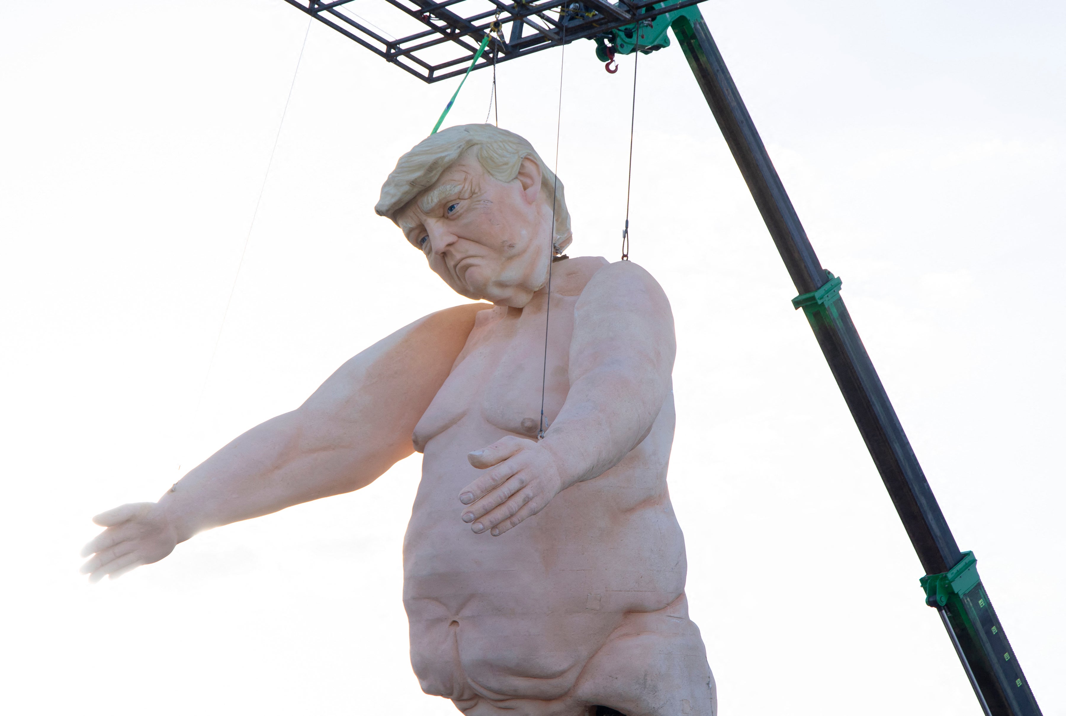 A 43-foot-tall naked statue resembling former US President and Republican presidential candidate Donald Trump is displayed in a fenced-in lot near Interstate 15 north of Las Vegas. The statue mysterioulsy vanished days after it was erected