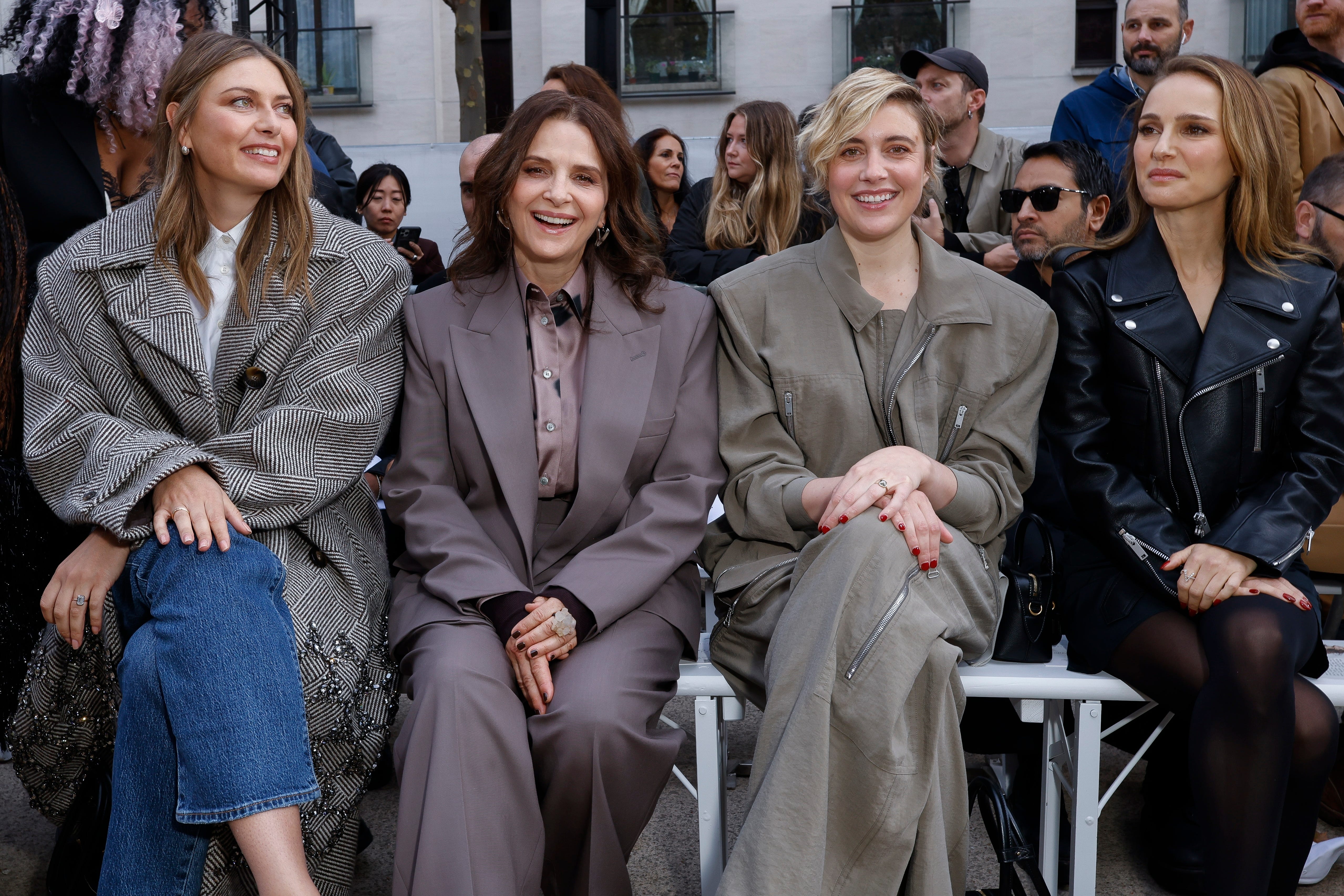 Maria Sharapova, Juliette Binoche, Greta Gerwig and Natalie Portman support Stella McCartney’s wet outdoor fashion show (Vianney Le Caer/AP)