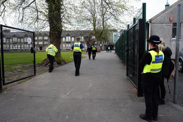 Police officers outside Amman Valley school, in Ammanford, Carmarthenshire (Ben Birchall/PA)