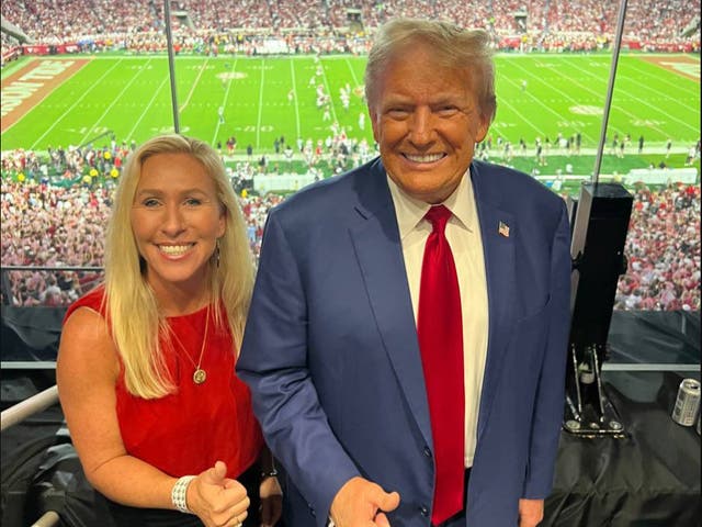 <p>Georgia Republican Marjorie Taylor Greene and Donald Trump at the Georgia v Alabama college football game on Saturday in Tuscaloosa. Greene was slammed for her appearance in Alabama while her home state was devastated by Hurricane Helene</p>