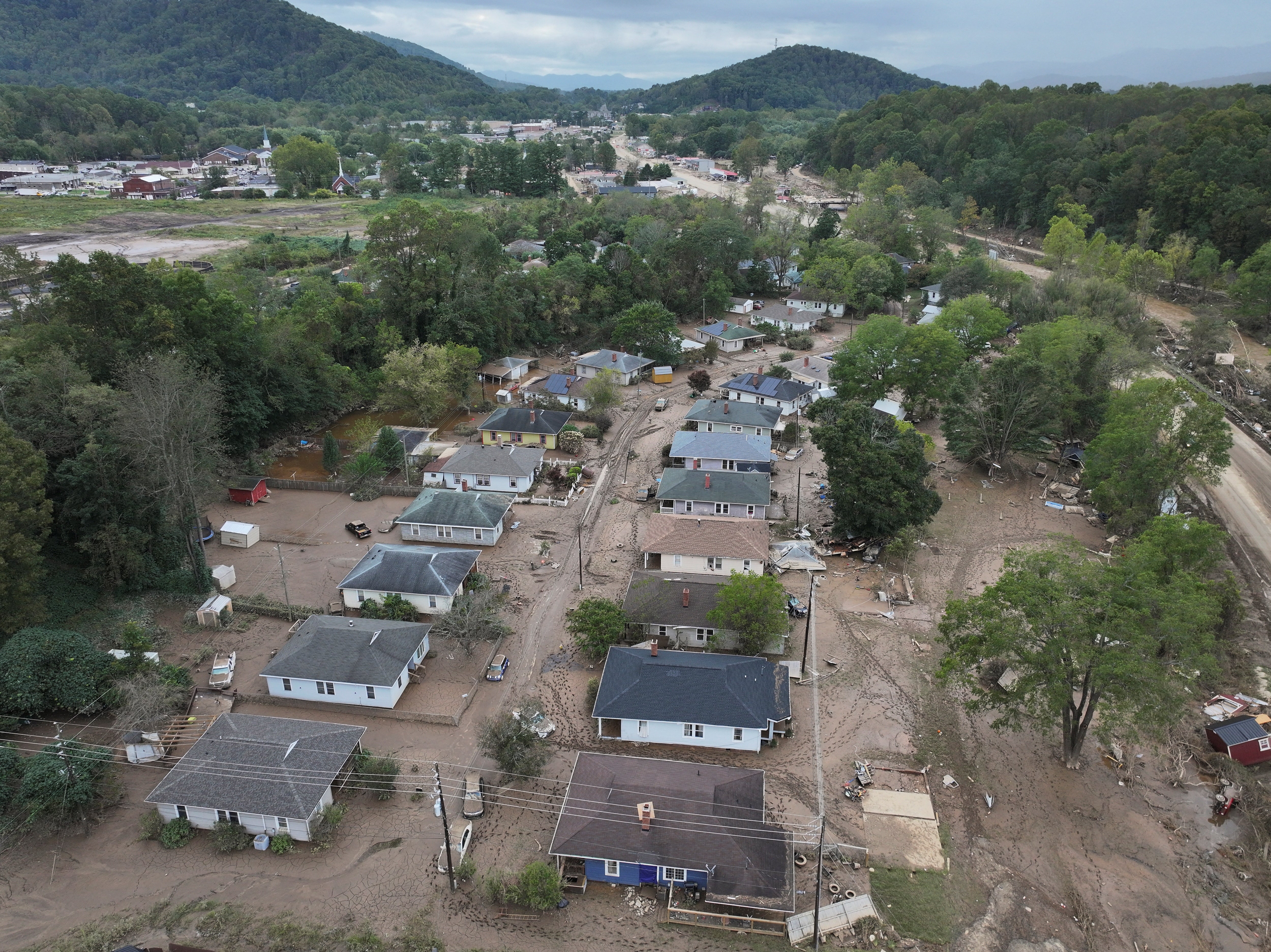 A drone image shows damaged houses in Swannanoa, North Carolina, on Sunday. The Swannanoa River reached flood levels not seen since 1791.