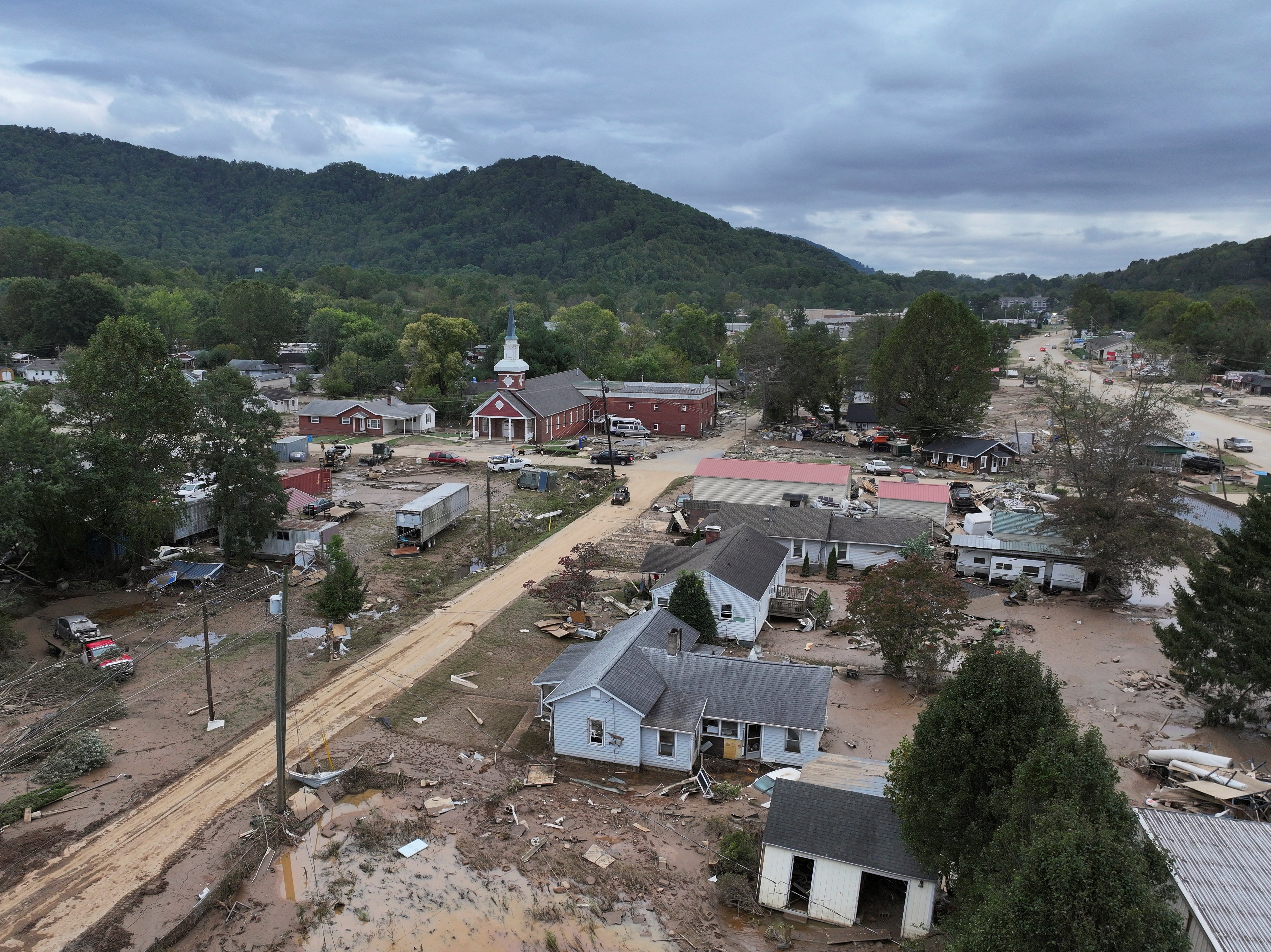 A drone image taken Sunday in Swannanoa, North Carolina, shows roads and homes washed out by Hurricane Helene. Flood threats continued on Monday morning.