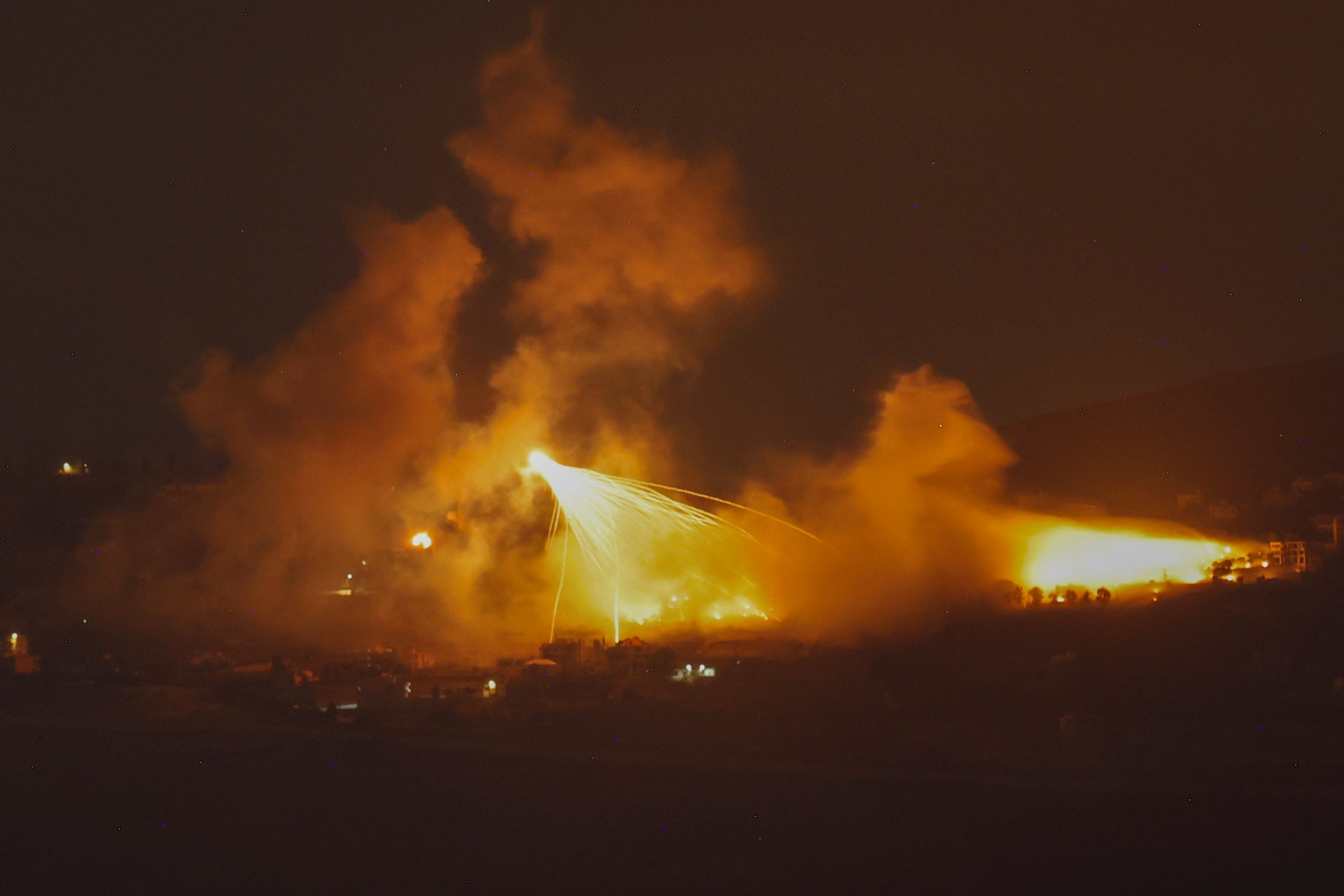 A picture taken from northern Israel, along the border with southern Lebanon, on September 30, 2024 shows a fire following Israeli bombardment on an area of south Lebanon.