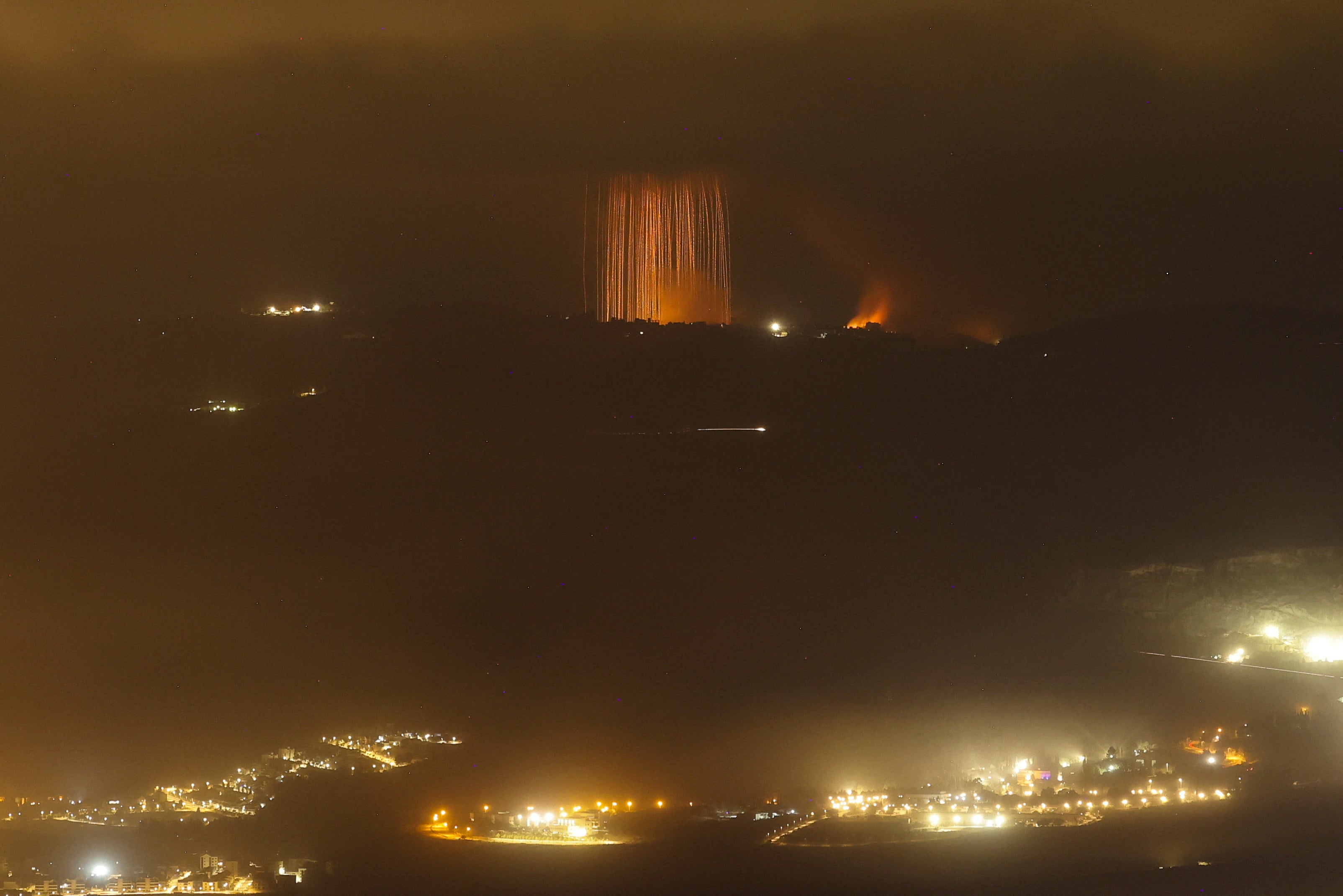 A picture taken from northern Israel, along the border with southern Lebanon, on 30 September 2024 shows a fire following Israeli bombardment on an area of south Lebanon