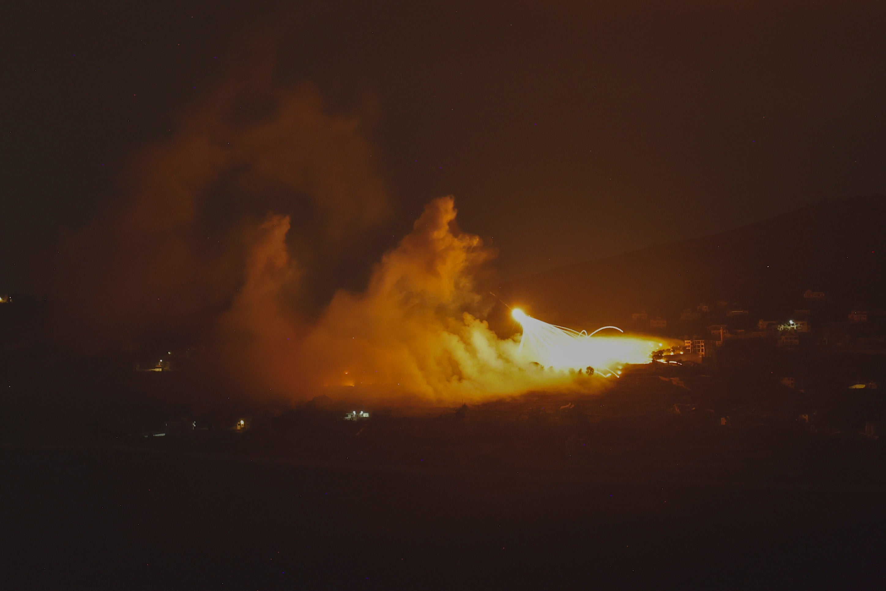 A picture taken from northern Israel, along the border with southern Lebanon, on 30 September 2024 shows a fire following Israeli bombardment on an area of south Lebanon