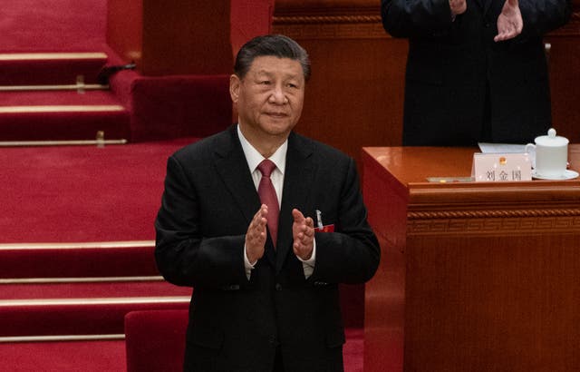 <p>Chinese President Xi Jinping, applauds at the closing session of the NPC, or National Peoples Congress at the Great Hall of the People in Beijing, China</p>