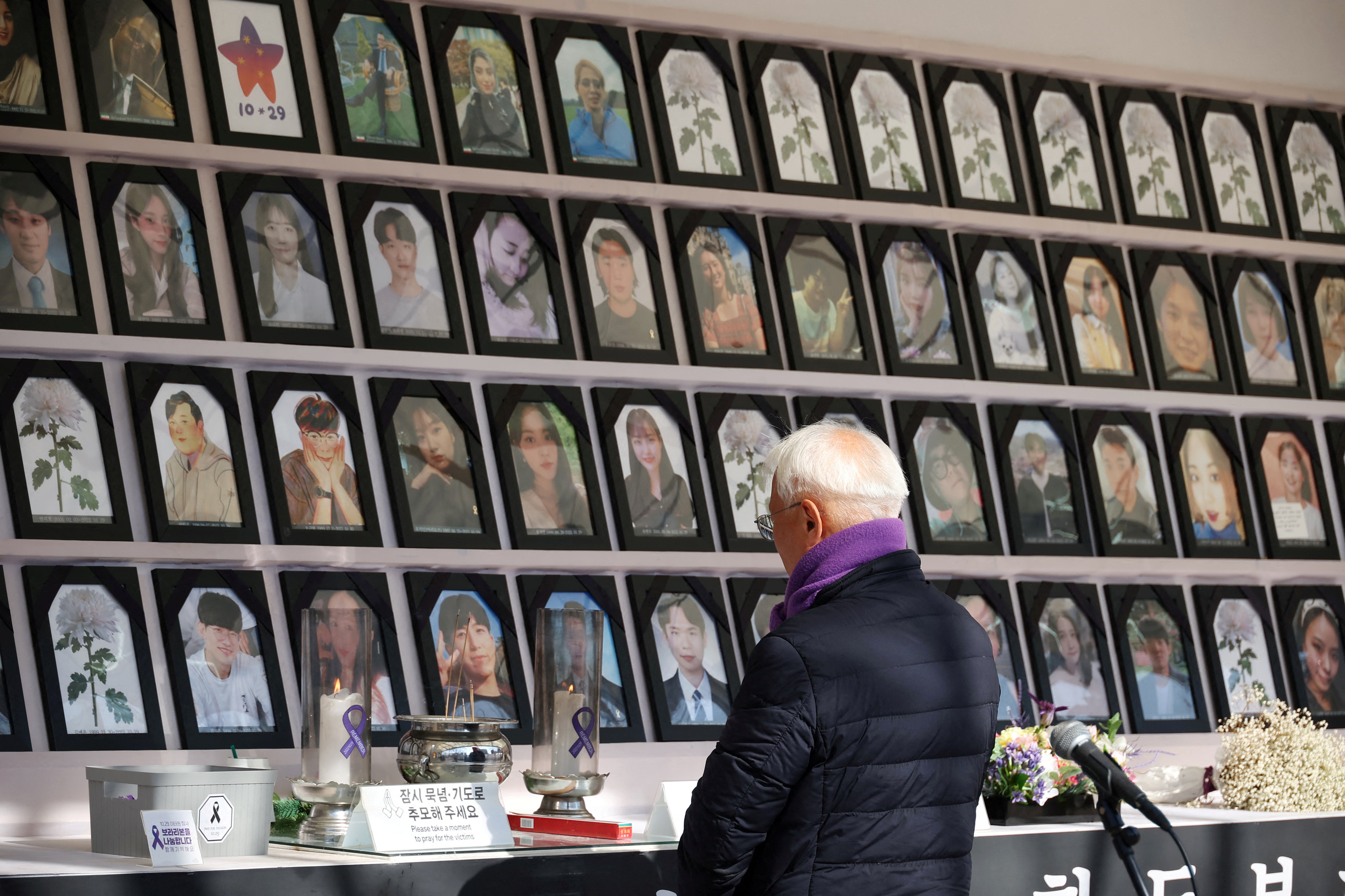 File. A man mourns at the memorial altar for victims of the Itaewon Halloween crowd crush that killed over 150 people in the party district of Itaewon, in Seoul, South Korea