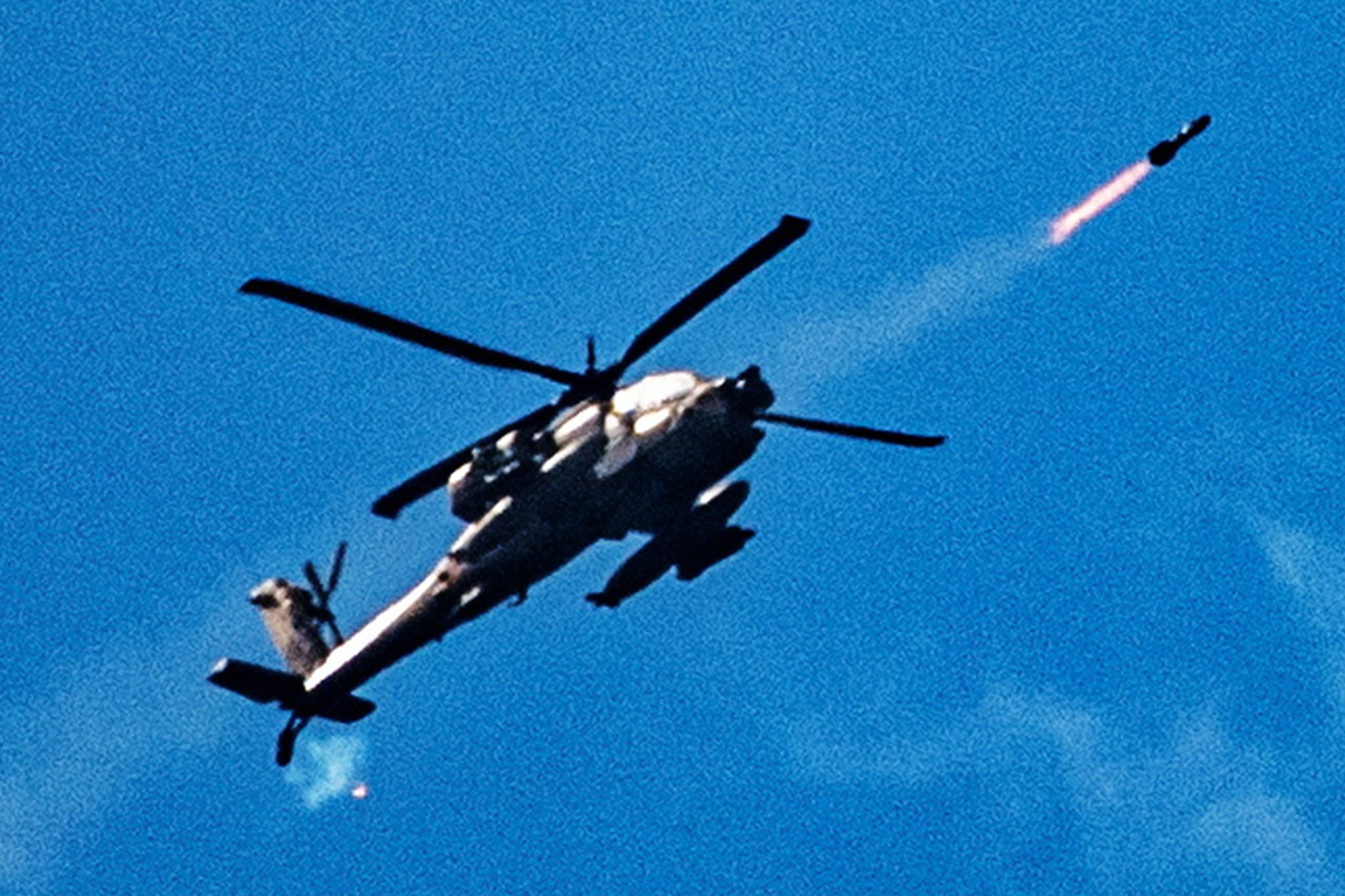 An Israeli attack helicopter fires towards Lebanon