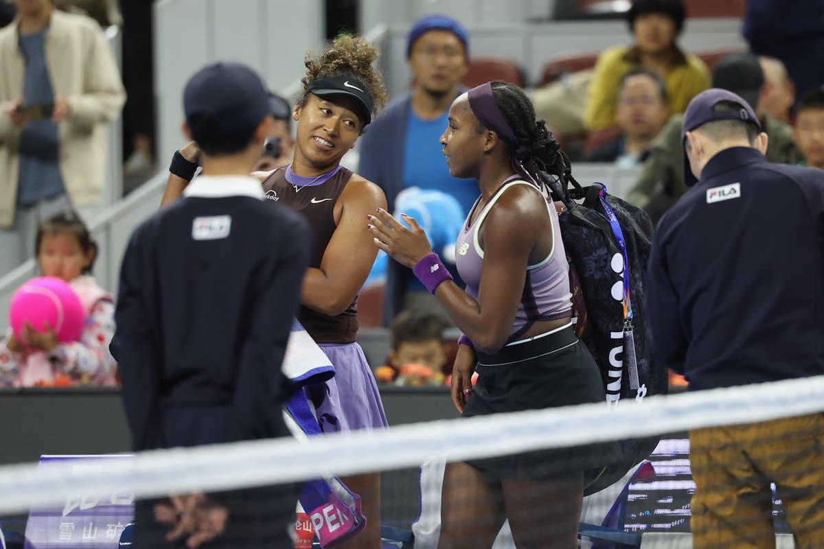 Coco Gauff helps carry Naomi Osaka’s bags off the court after her shocking exit from the China Open