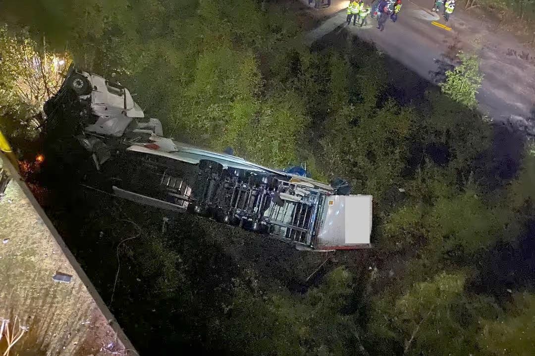 The lorry fell more than 60 feet from the Thelwall Viaduct (Cheshire Fire and Rescue Service/PA)