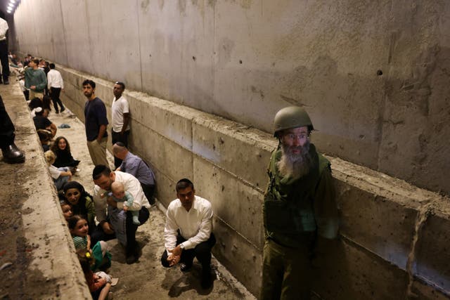 <p>Israeli civilians taking shelter as air raid sirens sound  </p>