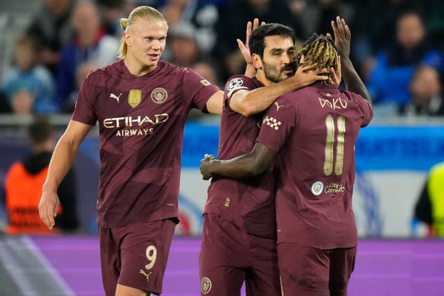 Ilkay Gundogan, centre, celebrates after scoring Manchester City’s opener (Petr Josek/AP)