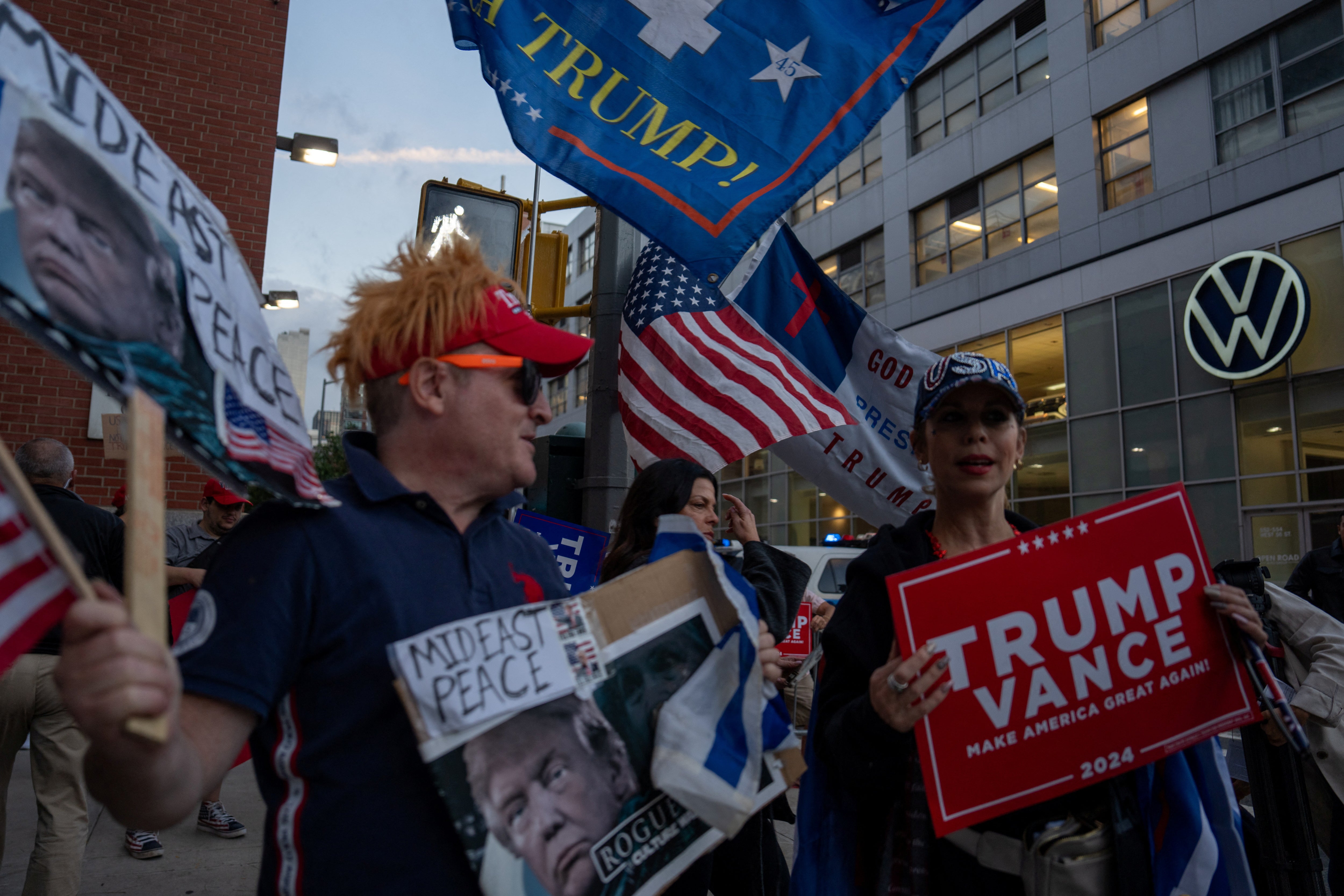 Supporters of Trump and Vance, and Harris and Walz, gathered outside the CBS studios on Tuesday evening ahead of the vice presidential debate