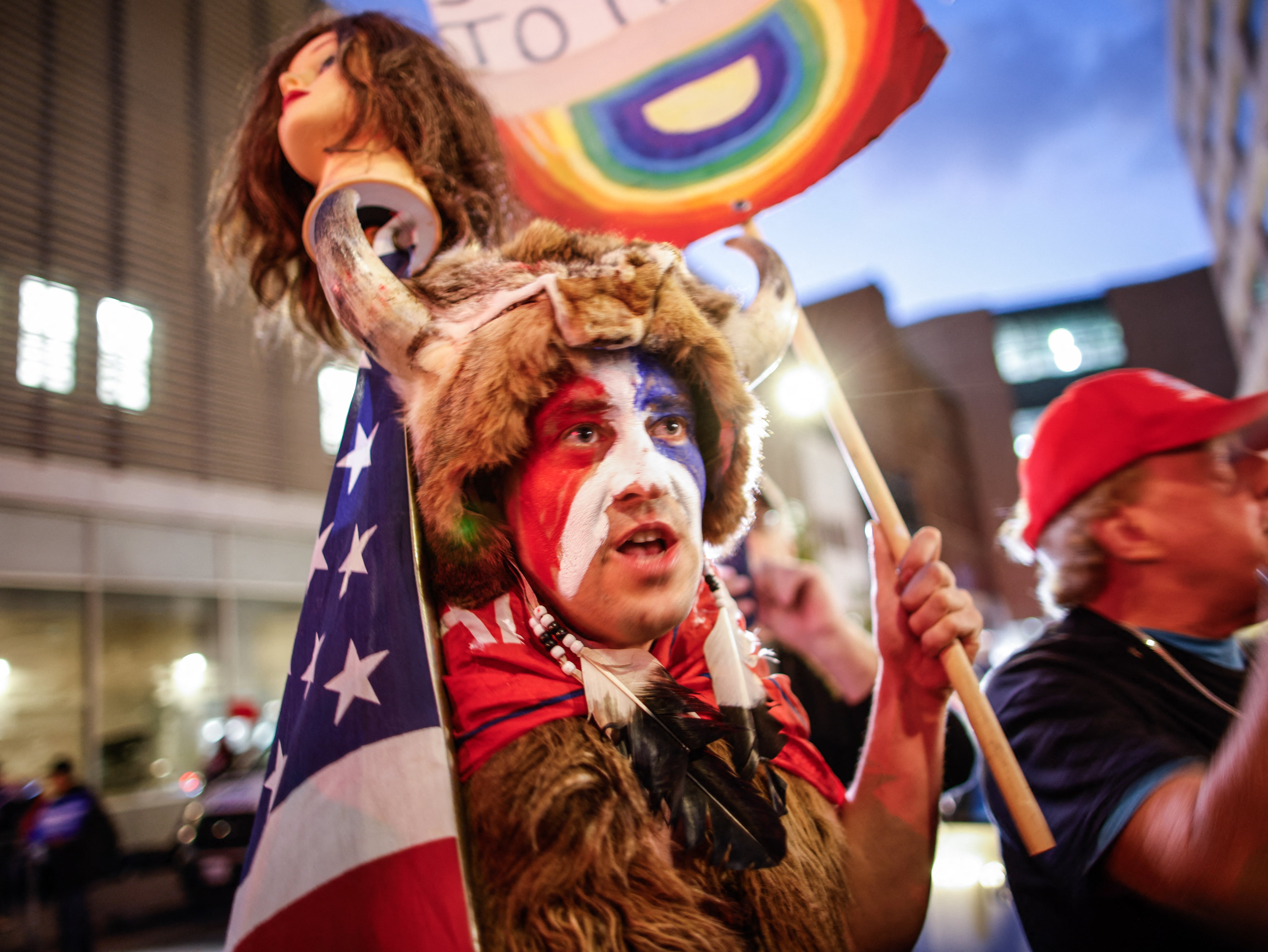 A supporter of former US President Donald Trump demonstrates outside the CBS Broadcast Center