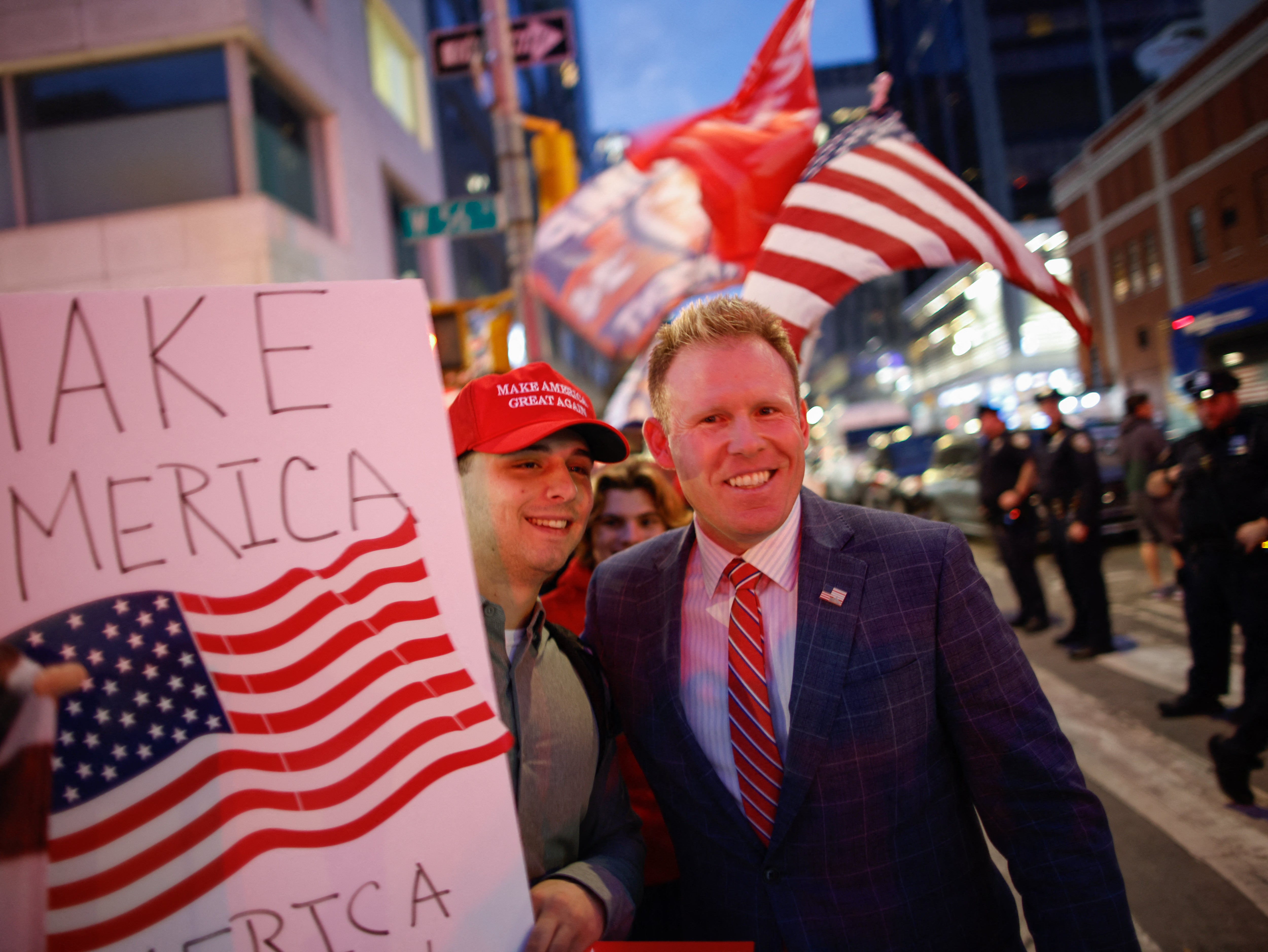 Andrew Giuliani, right, son of former New York City Mayor Rudy Giuliani, greets supporters of former US President Donald Trump outside the CBS Broadcast Center