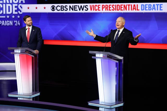 <p>Vice presidential debate moderators hammered Minnesota governor Tim Walz (right) over making false claims he was in Hong Kong during the 1989 Tiananmen Square massacre in China. Walz is pictured on stage alongside Republican candidate JD Vance </p>