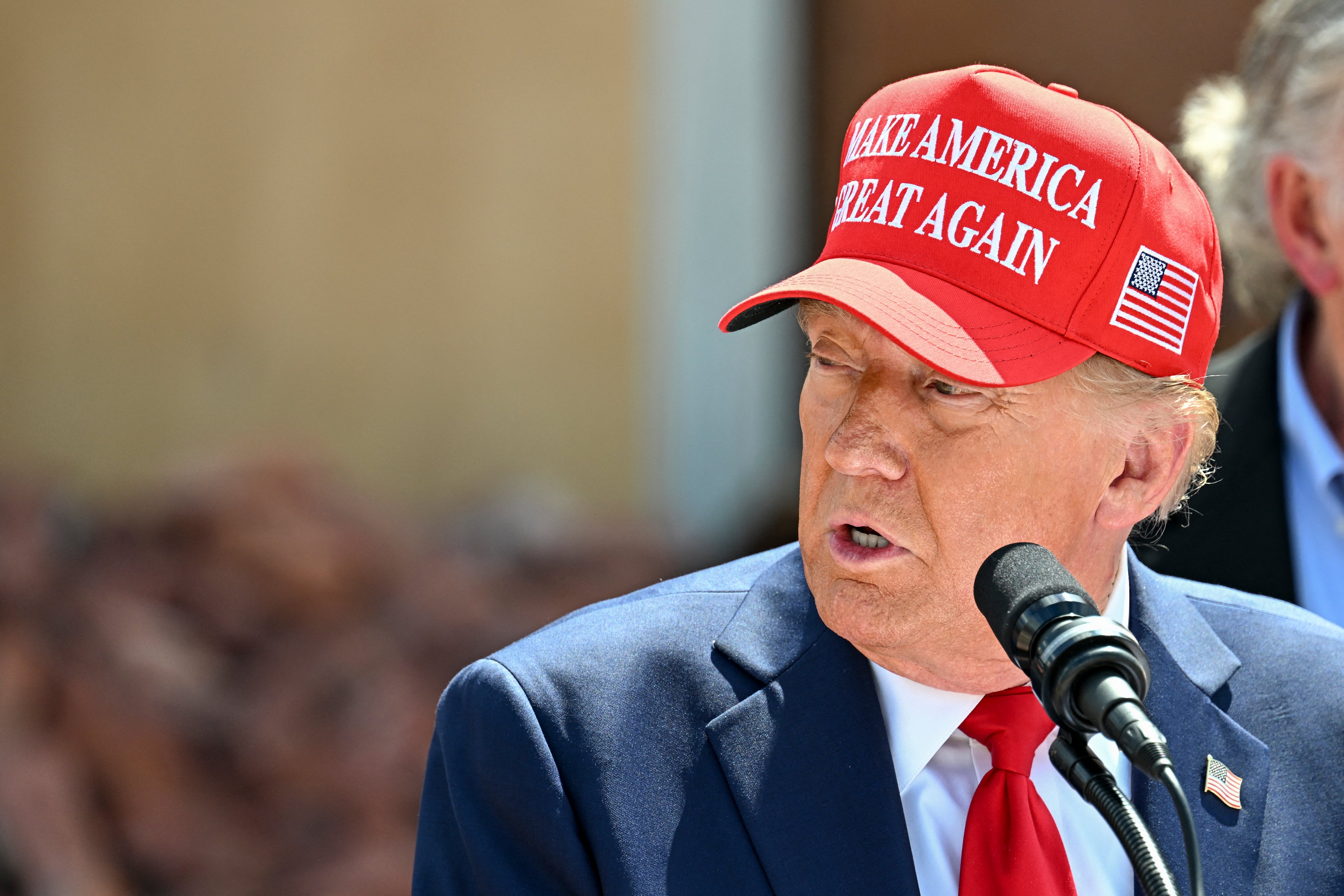 Former US President and Republican presidential candidate Donald Trump delivers remarks to the press in the aftermath of powerful storm Helene at Chez What furniture store in Valdosta, Georgia, September 30, 2024. A man who called into the Dan Abrams Show claimed that his father-in-law in North Carolina refuses to accept any federal aid despite having little food in the aftermath of Hurricane Helene because he ‘just believes Trump’