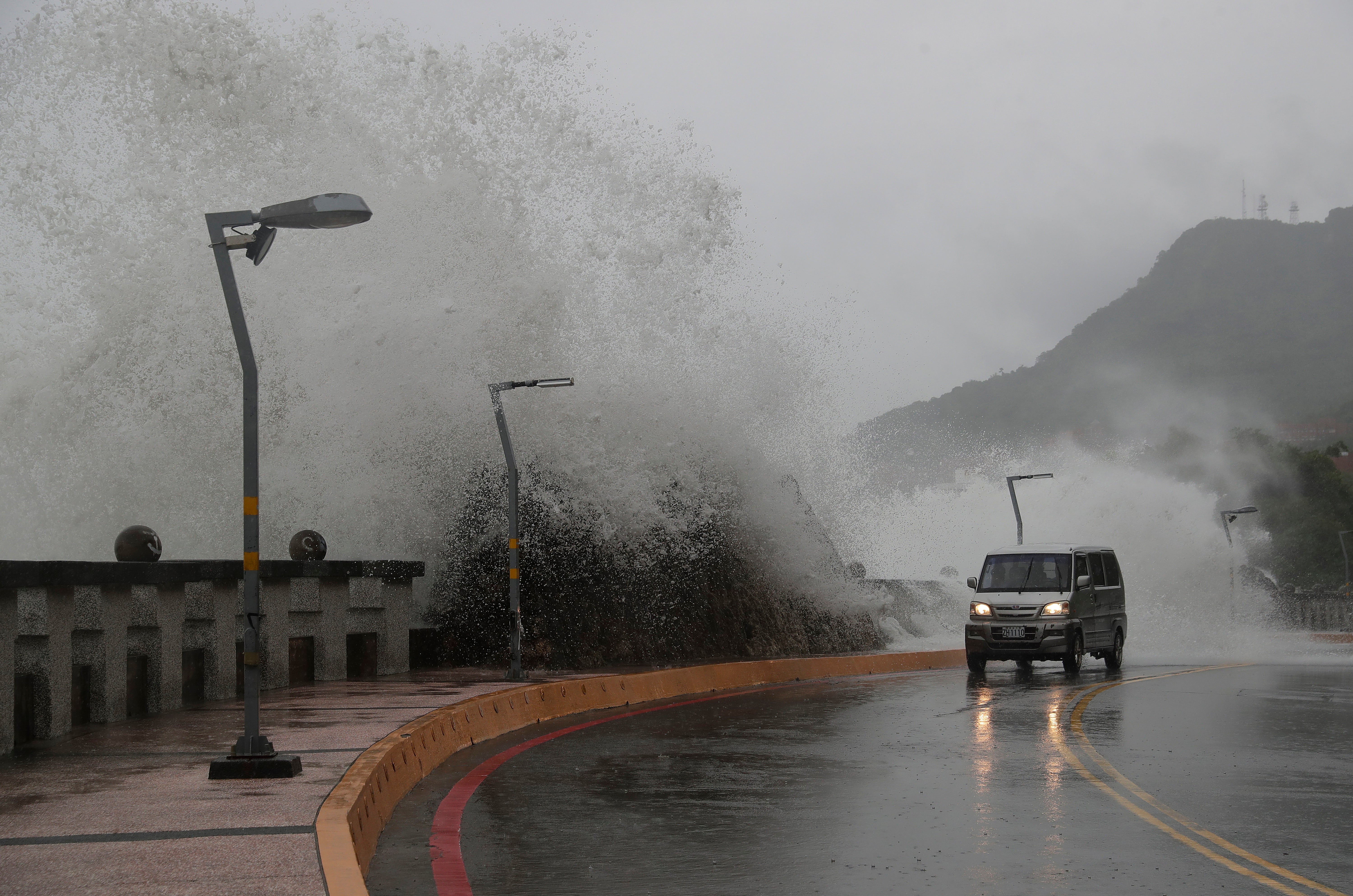 A car runs along the coast of Kaohsiung, southern Taiwan