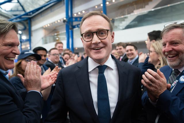 Tory leadership candidate, Tom Tugendhat walks past supporters after attending a hustings event during the Conservative Party Conference at the International Convention Centre in Birmingham (Stefan Rousseau/PA)