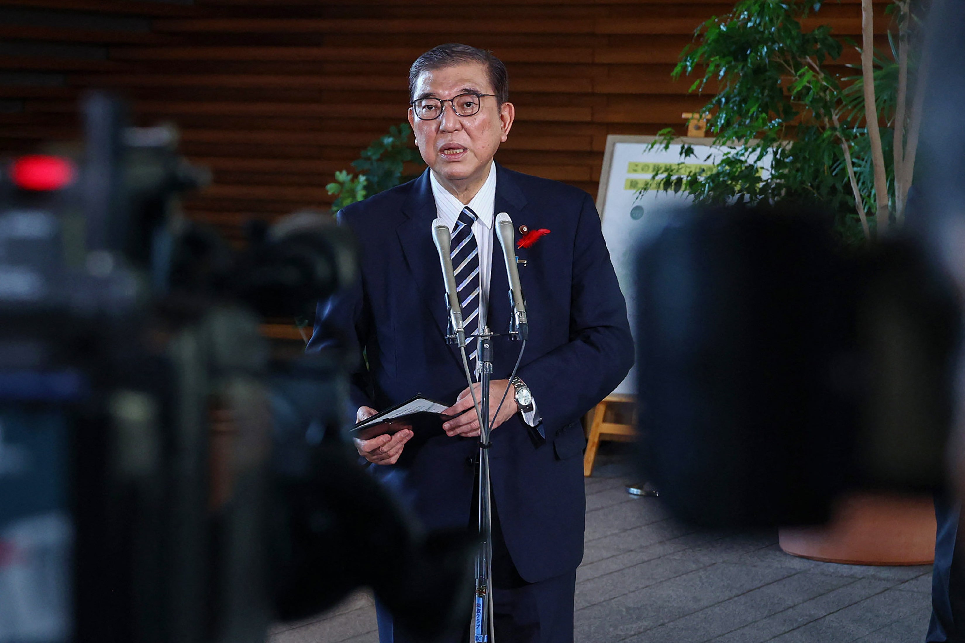 <p>Japan's new prime minister Shigeru Ishiba speaks to reporters at the entrance to the prime minister's office in Tokyo</p>