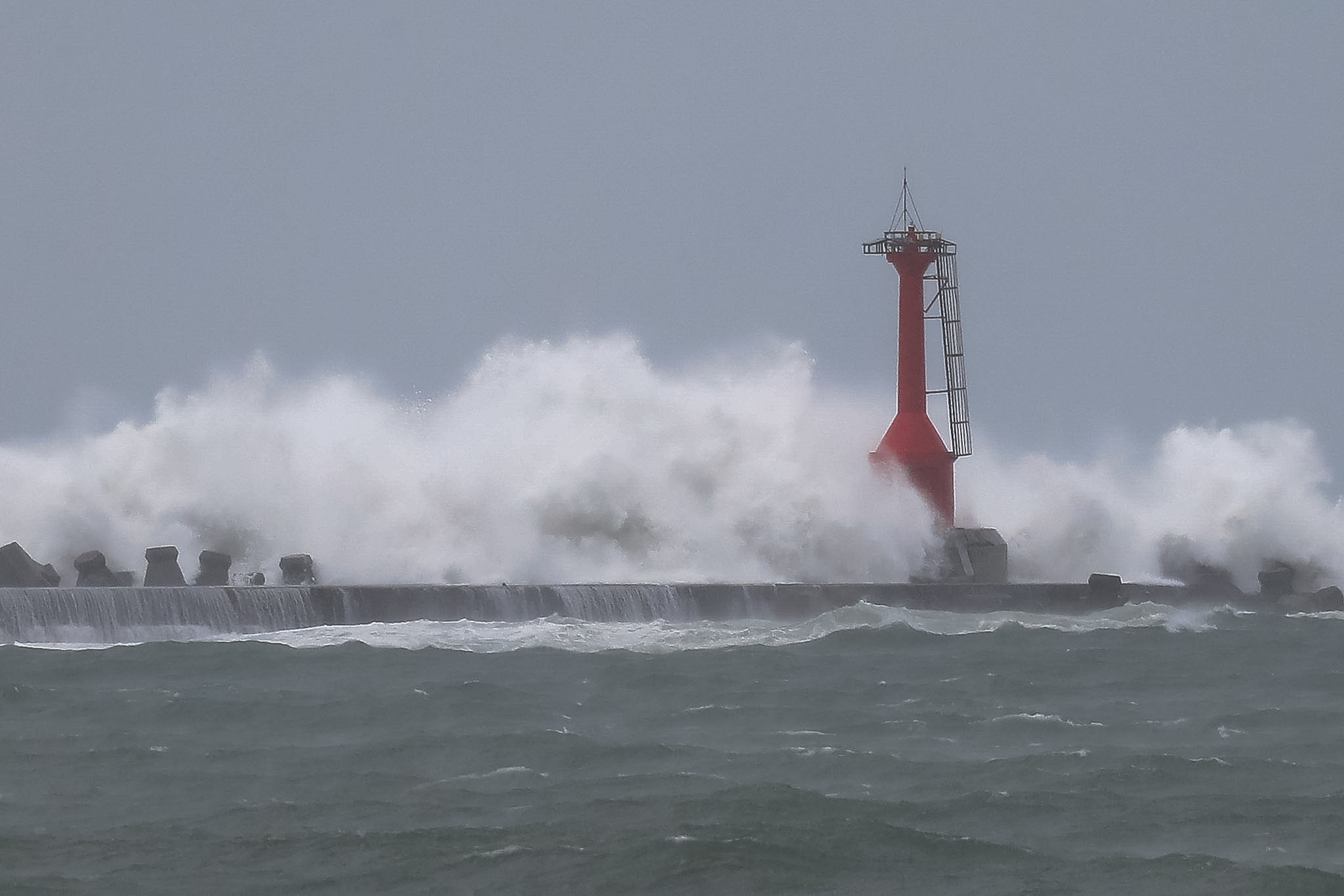 Strong waves batter the Sizihwan Bay, as Typhoon Krathon (Julien) brings rains and winds to the island, in the port city of Kaohsiung, Taiwan