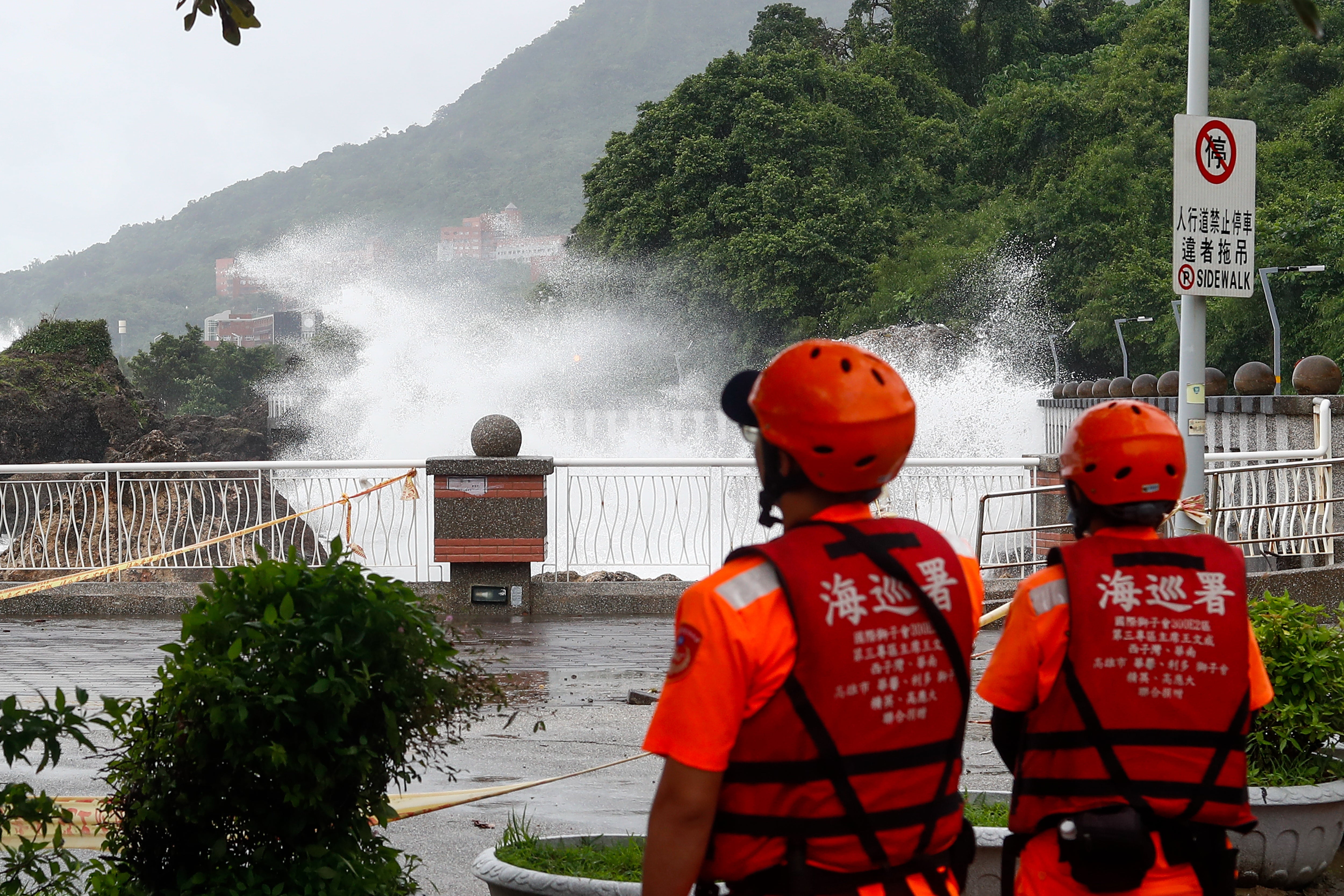 Taiwanese Coast Guards patrol the Sizihwan Bay as strong waves batter the coast, while Typhoon Krathon (Julien) brings rains and winds to the island, in the port city of Kaohsiung, Taiwan