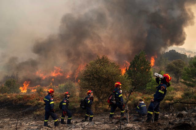 <p>A firefighter drinks water during a third day of a wildfire in Sofiana village, about 142 kilometers (88 miles) west of Athens, Greece, on Tuesday, October 1</p>