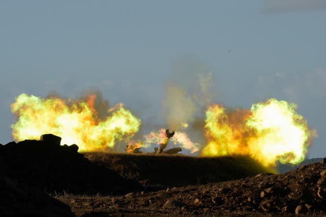 <p>An Israeli mobile artillery unit fires a shell from northern Israel towards Lebanon</p>