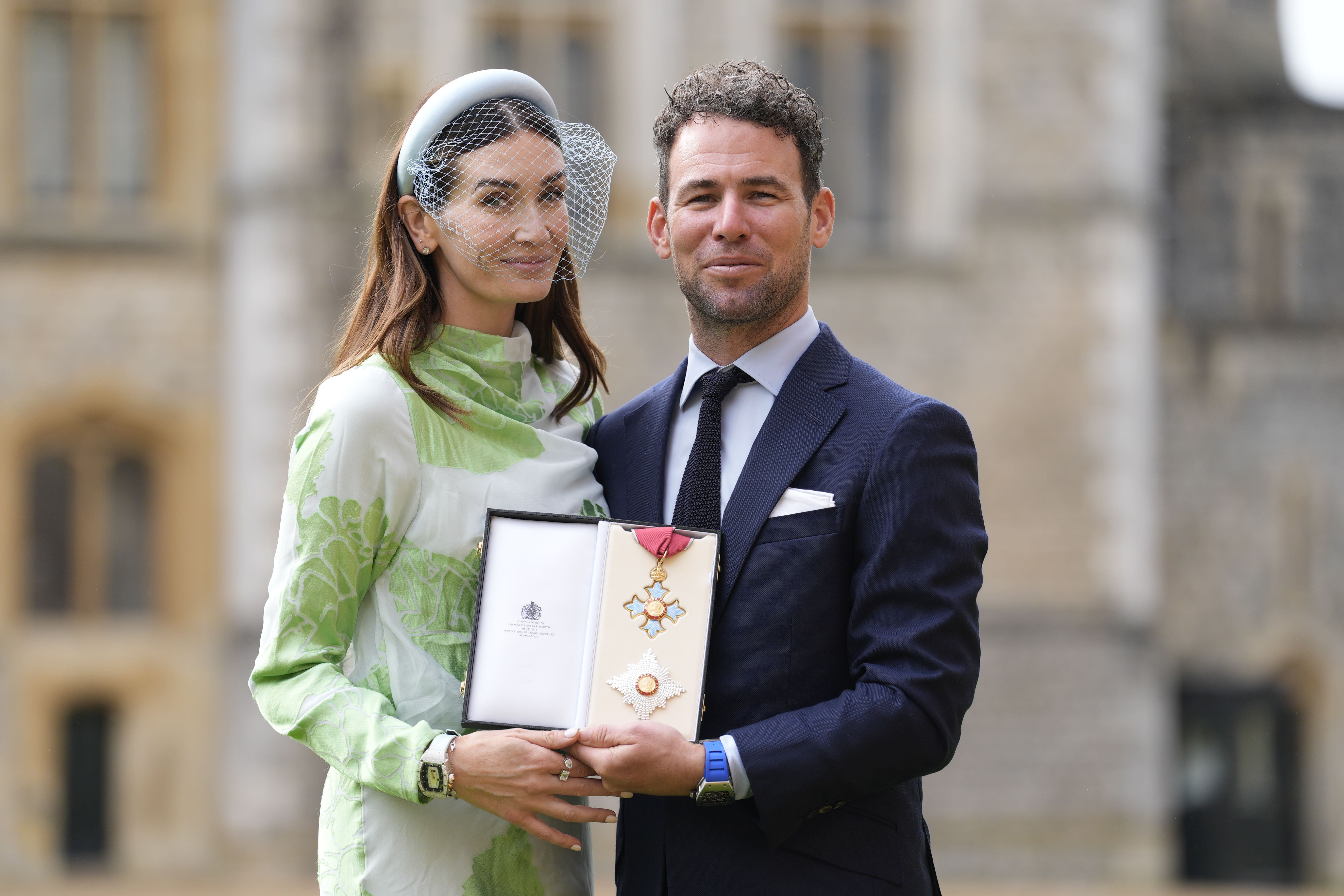 Cyclist Sir Mark Cavendish with his wife Peta after being made Knight Commander of the British Empire during an investiture ceremony at Windsor Castle (Andrew Matthews/PA)