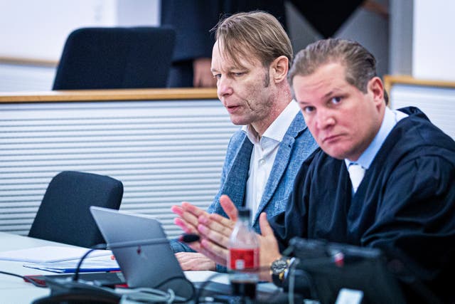 <p>The defendant Christian B., left, accused of three cases of aggravated rape and two cases of sexual abuse of children in Portugal, sits next to his defense attorney Friedrich F'lscher in a courtroom in the district court in Brunswick, Germany, Wednesday Oct. 2, 2024</p>