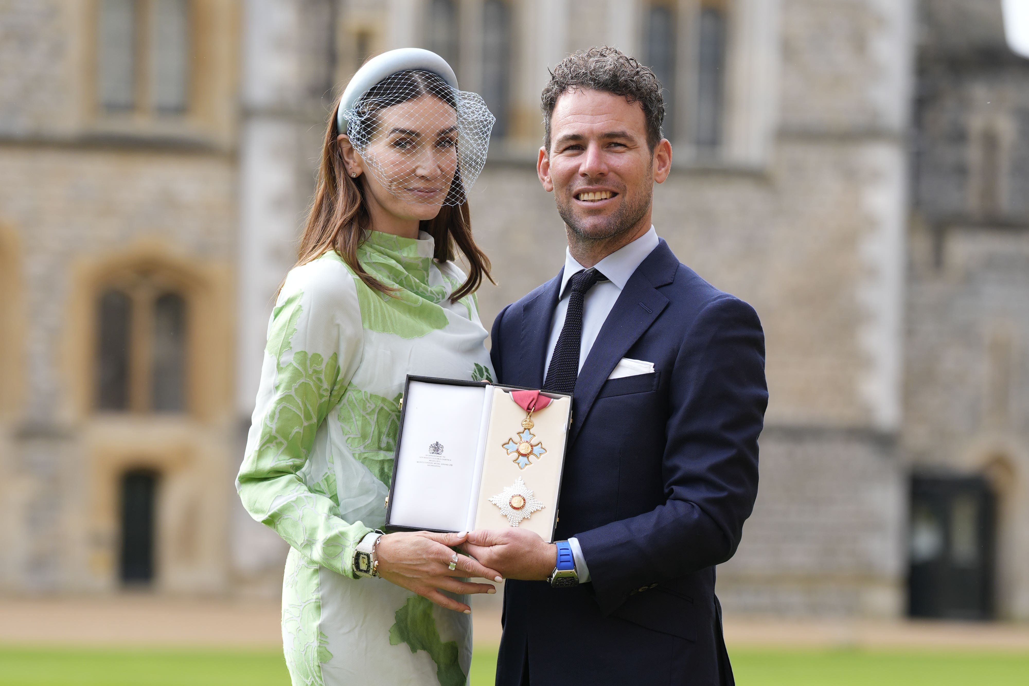 Sir Mark Cavendish with his wife Peta after being made Knight Commander of the British Empire during an investiture ceremony at Windsor Castle (Andrew Matthews/PA)